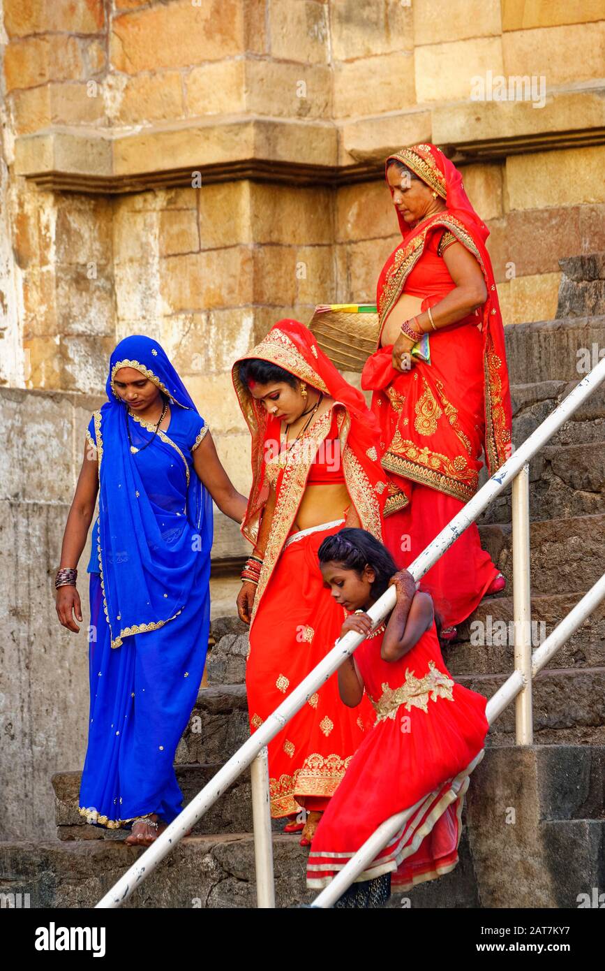 Worshipers going down stairs of a temple, Khajuraho, Madhya Pradesh state, India Stock Photo