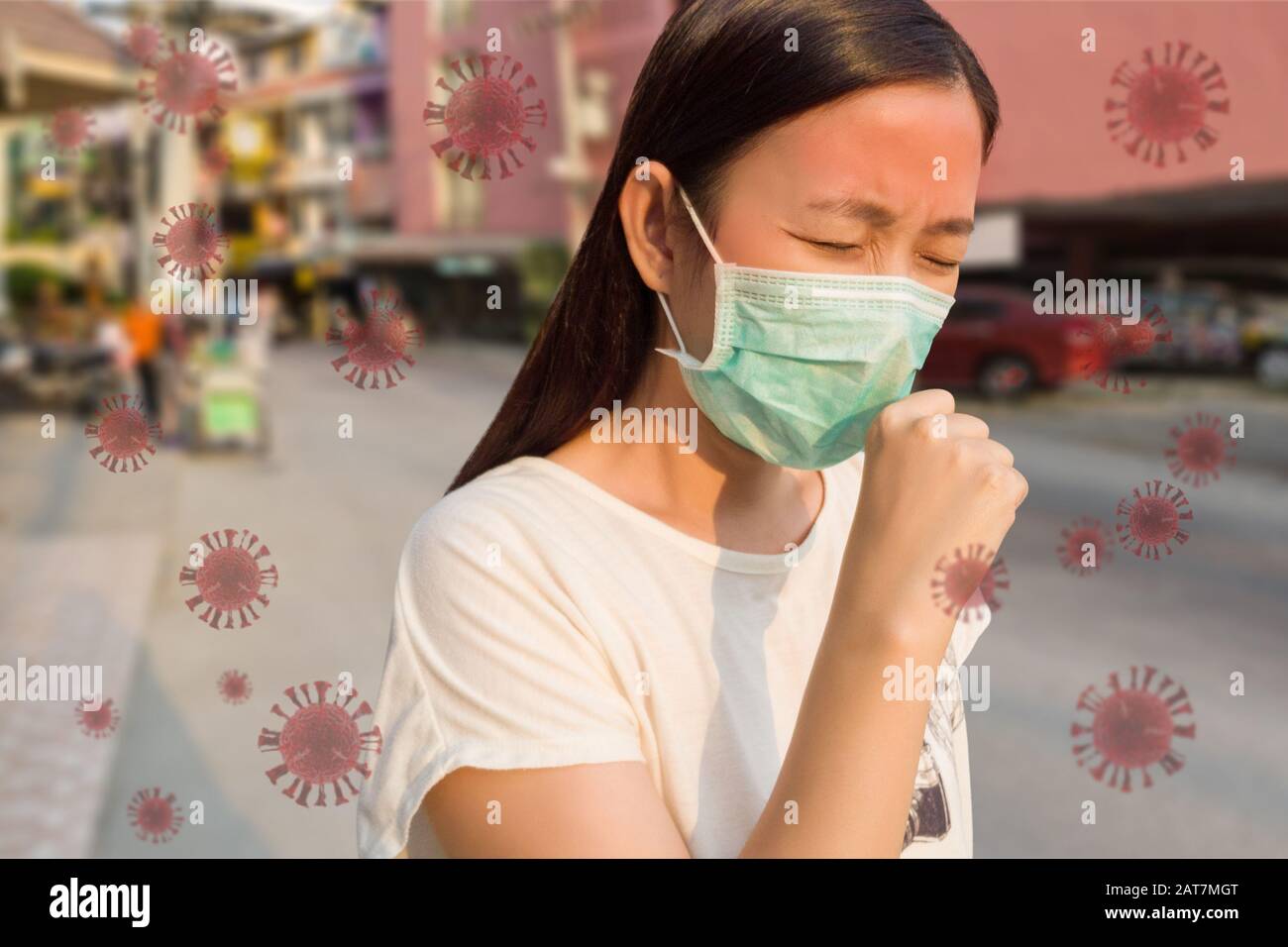 woman feeling sick, coughing, wearing protective mask against transmissible infectious diseases and as protection against the flu. new Coronavirus 201 Stock Photo