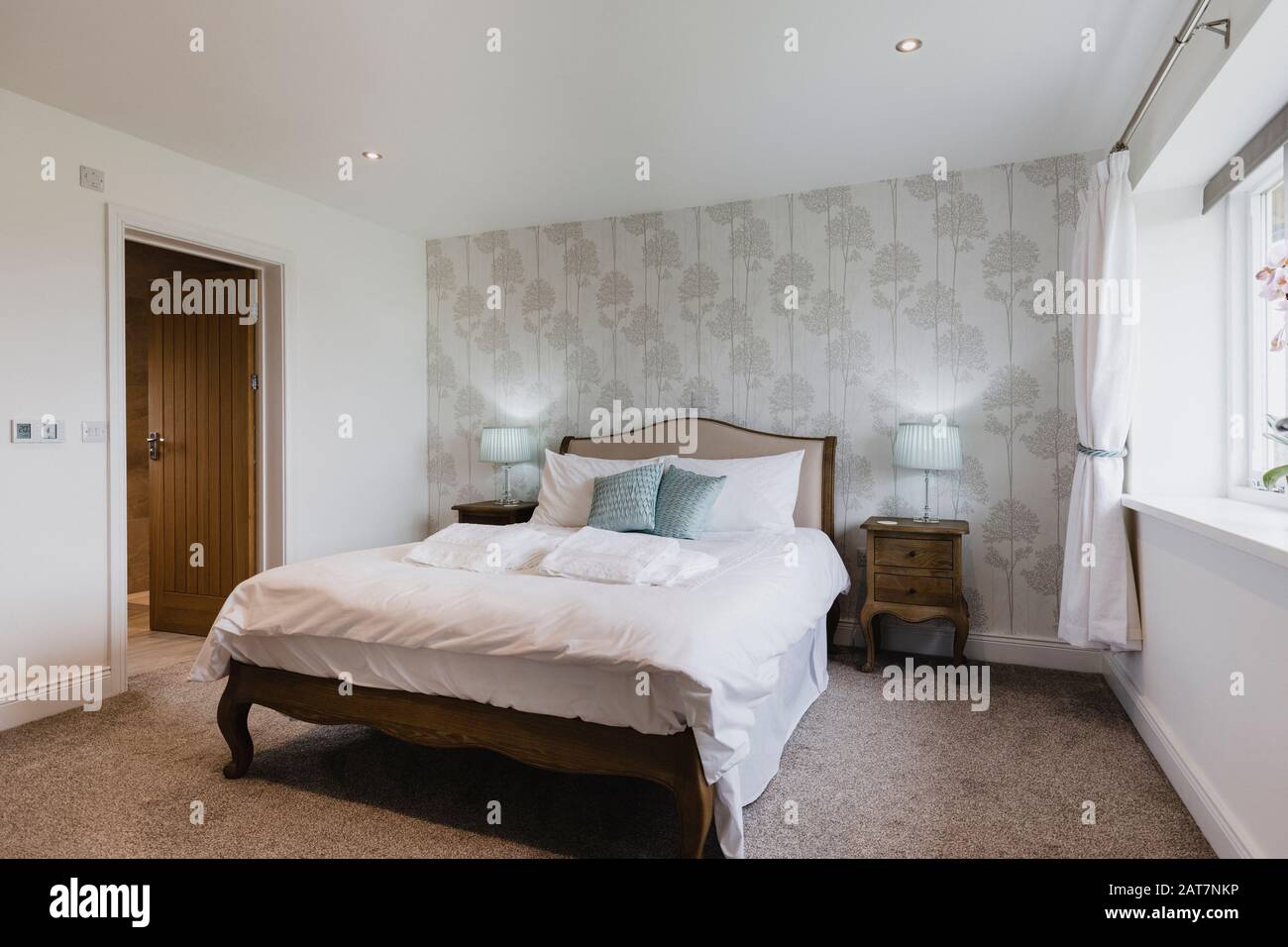 A wide-view shot of a modern bedroom in Northeastern England. Stock Photo