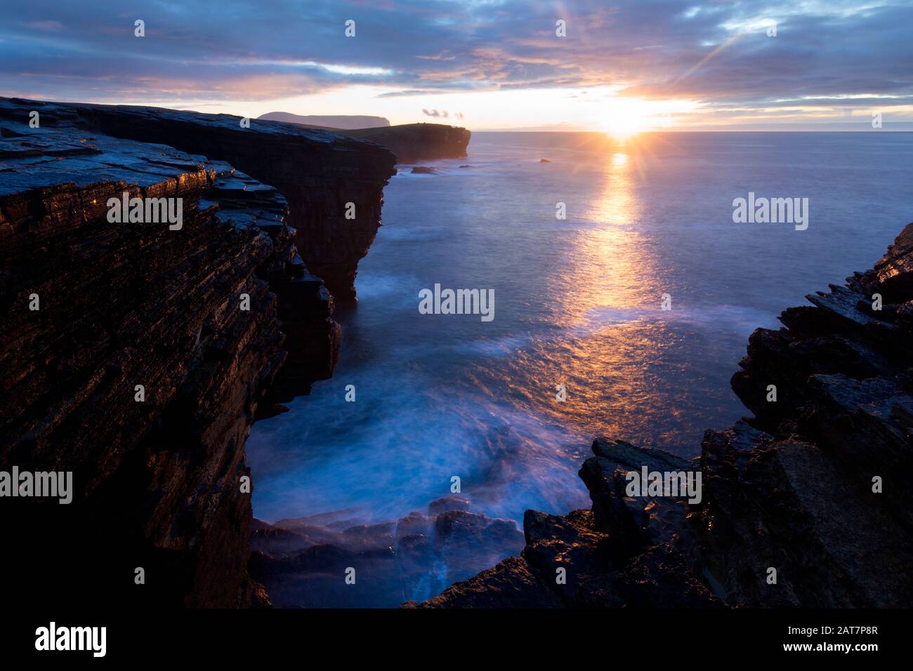 Dramatic sunset on winter solstice, Yesnaby Cliffs Stock Photo