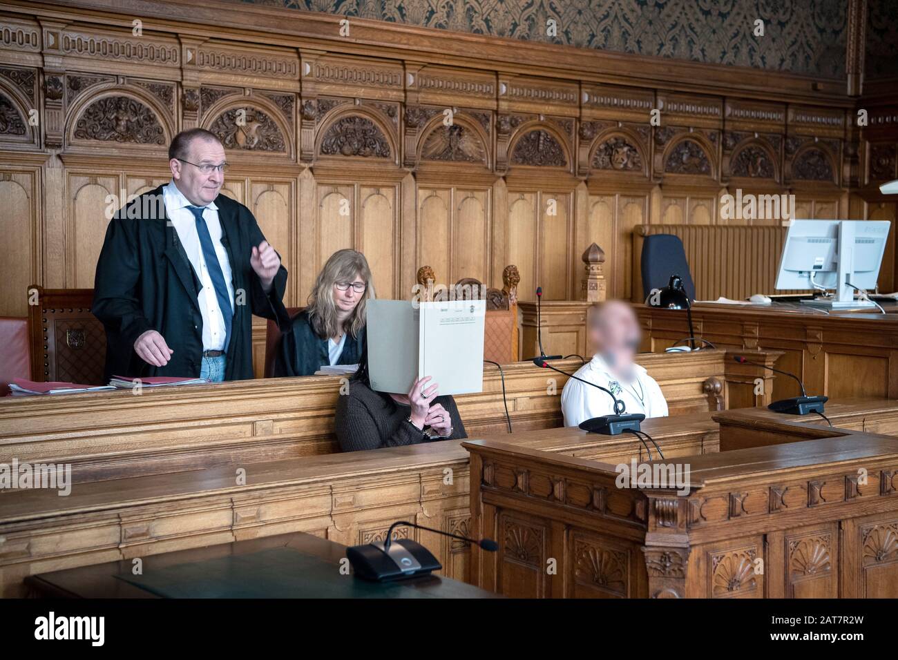 Bremen, Germany. 31st Jan, 2020. The defendants in the murder trial are sitting in the courtroom with the lawyer Thomas Domanski and the lawyer Angelika Fiessler before the trial begins. The two defendants were convicted of murder with a kitchen knife and a steak knife. The victim died from the injuries. Credit: Sina Schuldt/dpa - ATTENTION: Person(s) has (have) been pixelated for legal reasons/dpa/Alamy Live News Stock Photo