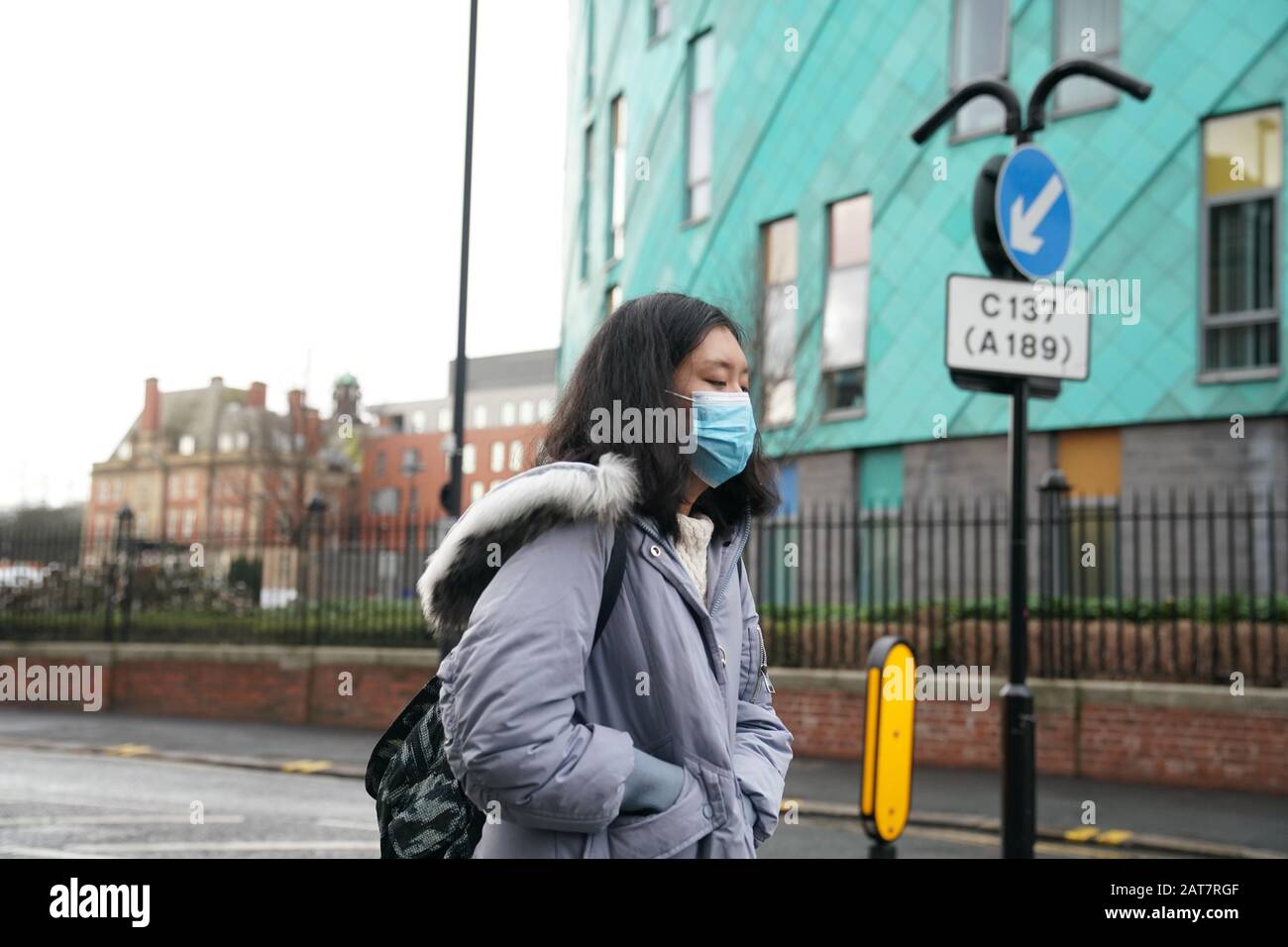 A woman wears a mask in Newcastle upon Tyne, near where two patients