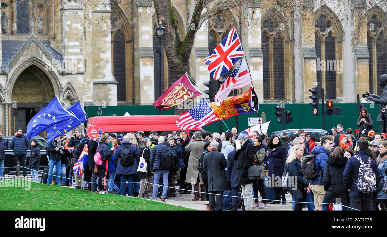 London UK 31st January 2020 - Pro Brexit supporters and anti Brexit supporters mix together in Parliament Square London as Britain prepares to leave the EU at 11pm later this evening 47 years after joining : Credit Simon Dack / Alamy Live News Stock Photo