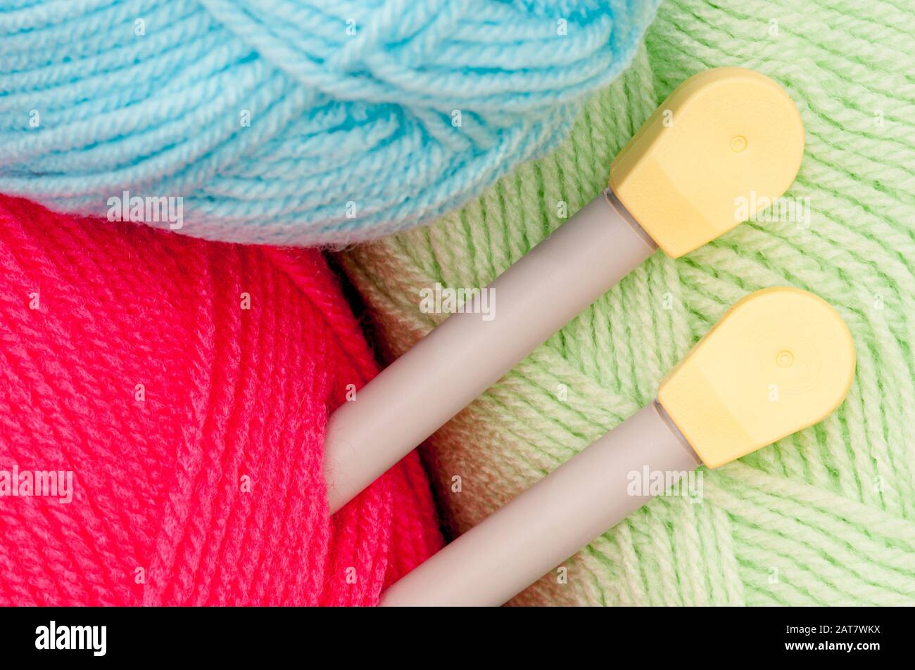 Balls of coloured wool with knitting needles Stock Photo