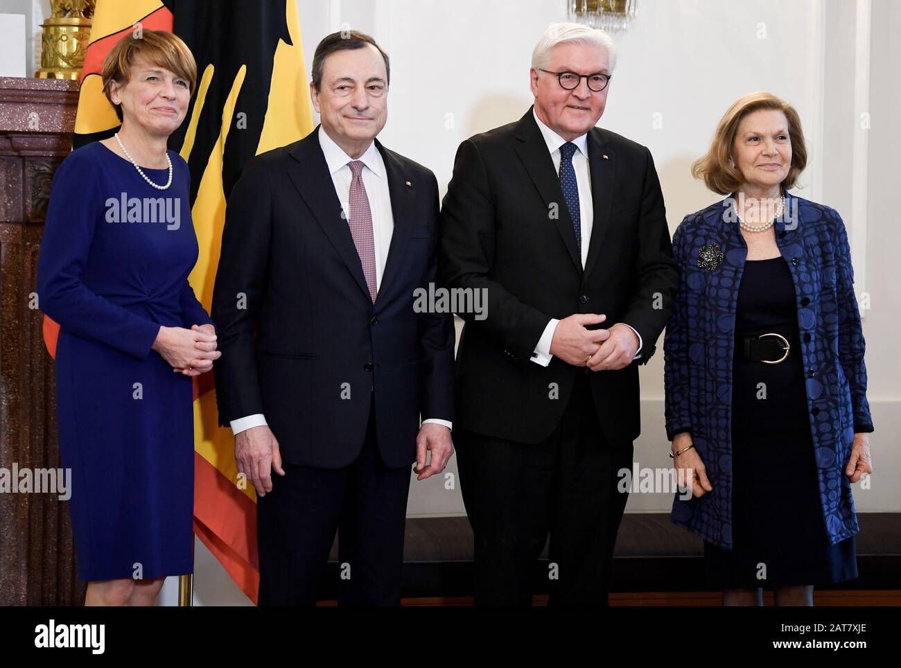 Berlin, Germany. 31st Jan, 2020. Elke Büdenbender (l-r), the wife of the Federal President, former ECB President Mario Draghi, Federal President Frank-Walter Steinmeier, and Draghis wife, Serena Draghi, stand at the award ceremony of the Federal Cross of Merit. Draghi received the Federal Cross of Merit from Federal President Steinmeier. Credit: Britta Pedersen/dpa-Zentralbild/dpa/Alamy Live News Stock Photo