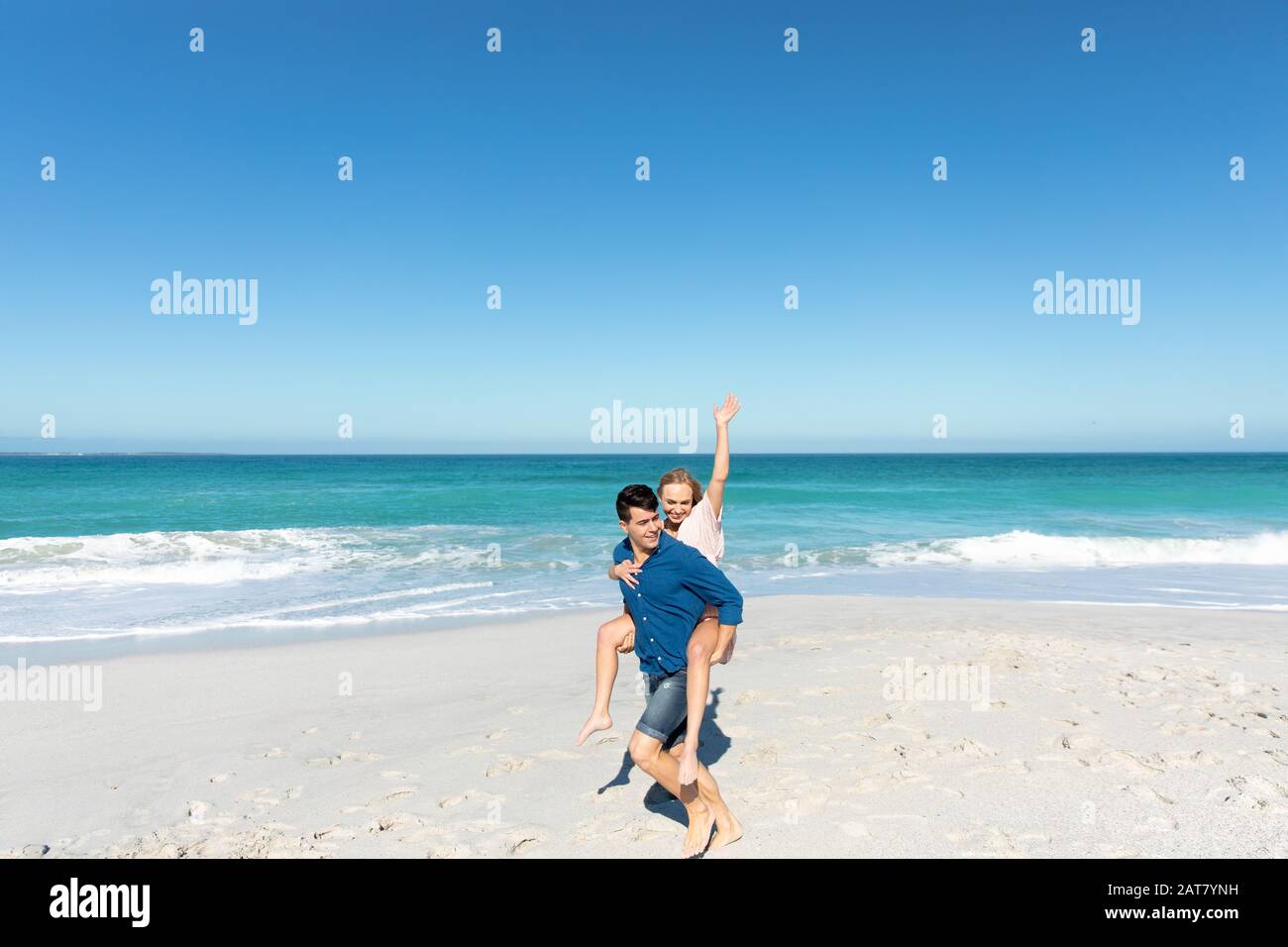 Young couple having fun at the beach Stock Photo