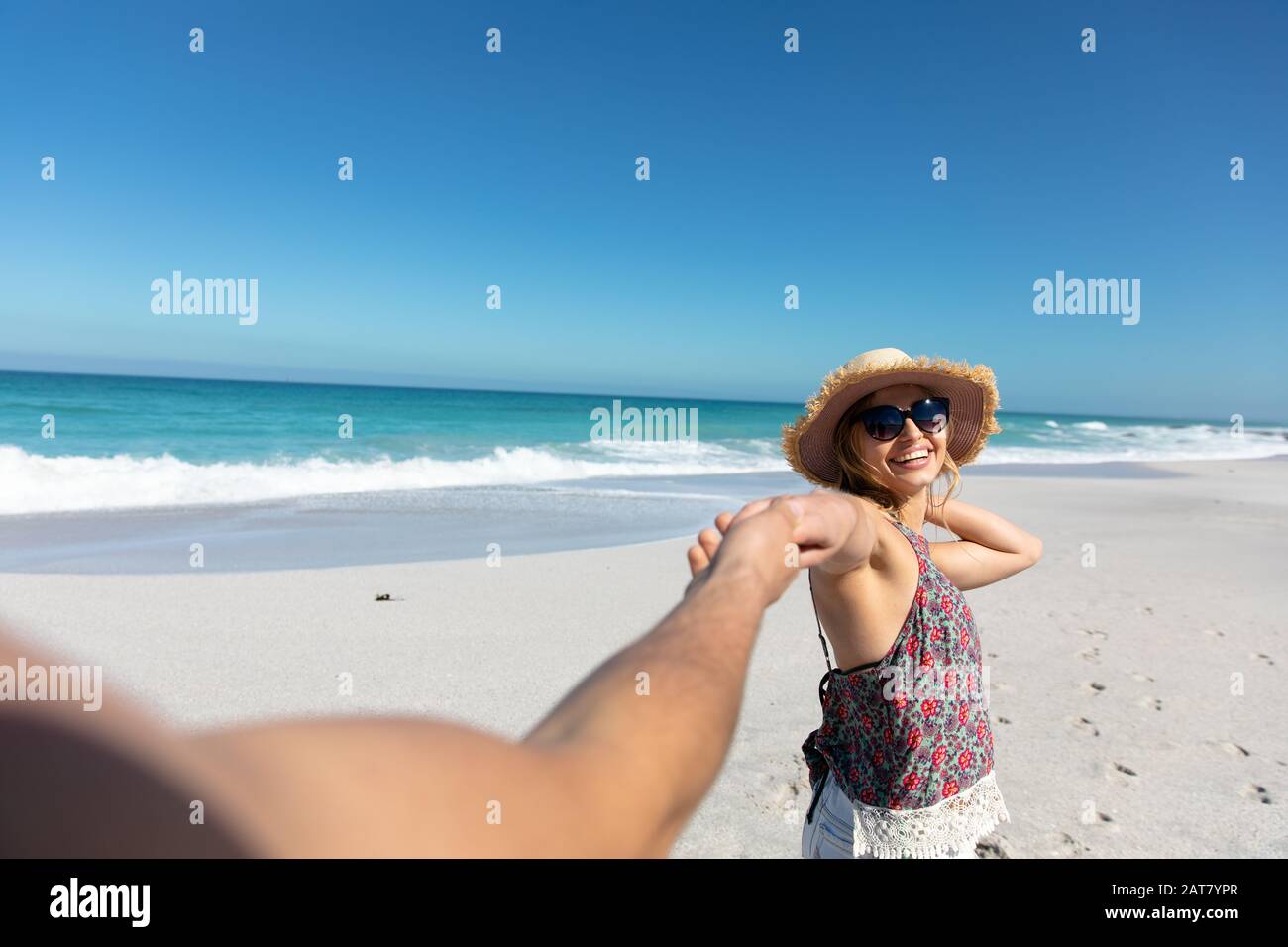 Young couple having fun at the beach Stock Photo