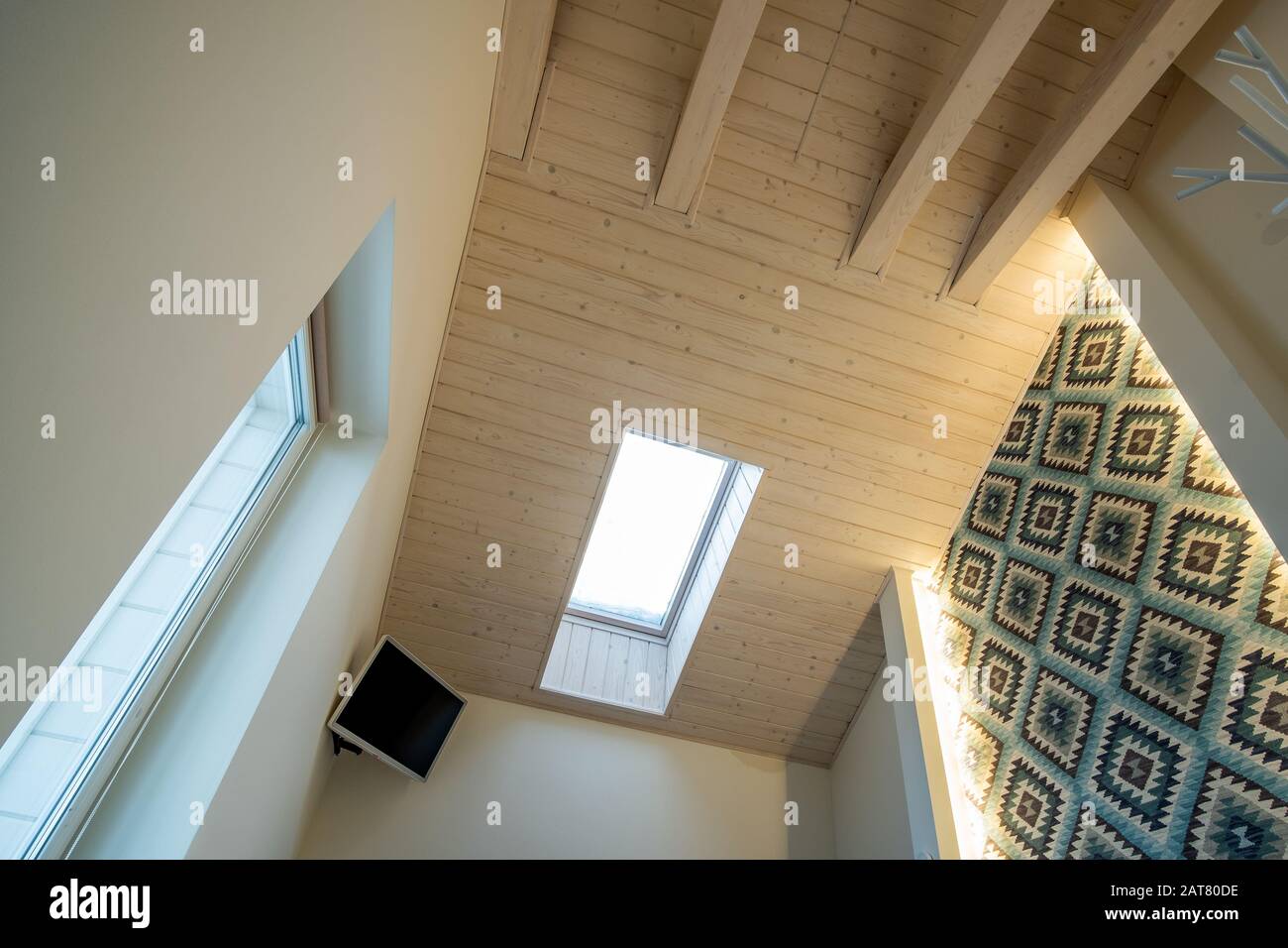 Wooden Ceiling In A Contemporary Mansard Room With Attic Window Ob