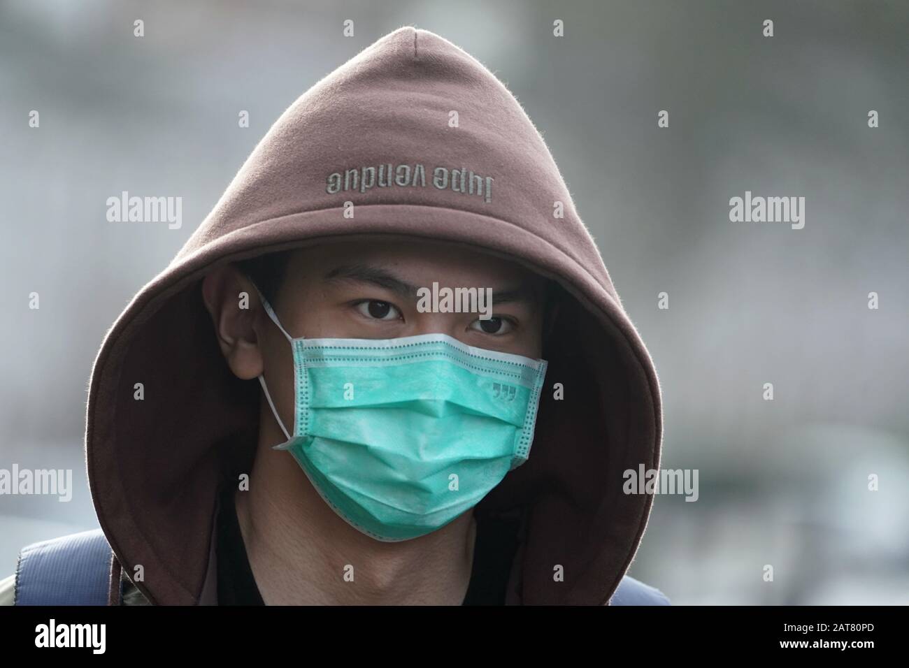 A man wears a mask in Newcastle upon Tyne, near where two patients who