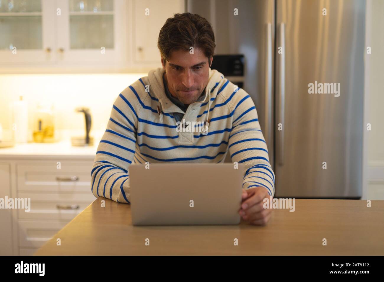 Using computer at home hi-res stock photography and images - Alamy