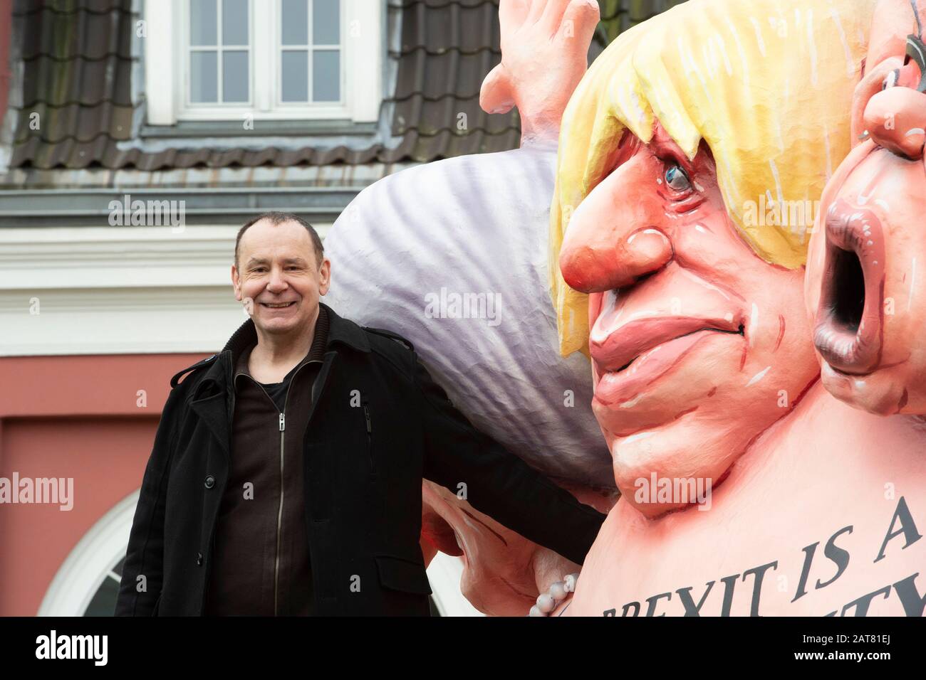 Jacques TILLY, artist, poses at the sculpture in front of Oberhausen Castle, BREXIT IS A MONSTROSITY, press conference on the occasion of the exhibition ,, Jacques Tilly C Politics and Provocation C Caricatures XXL ,, in the LUDWIGGALERIE Schloss Oberhausen, on 30.01.2020, | usage worldwide Stock Photo