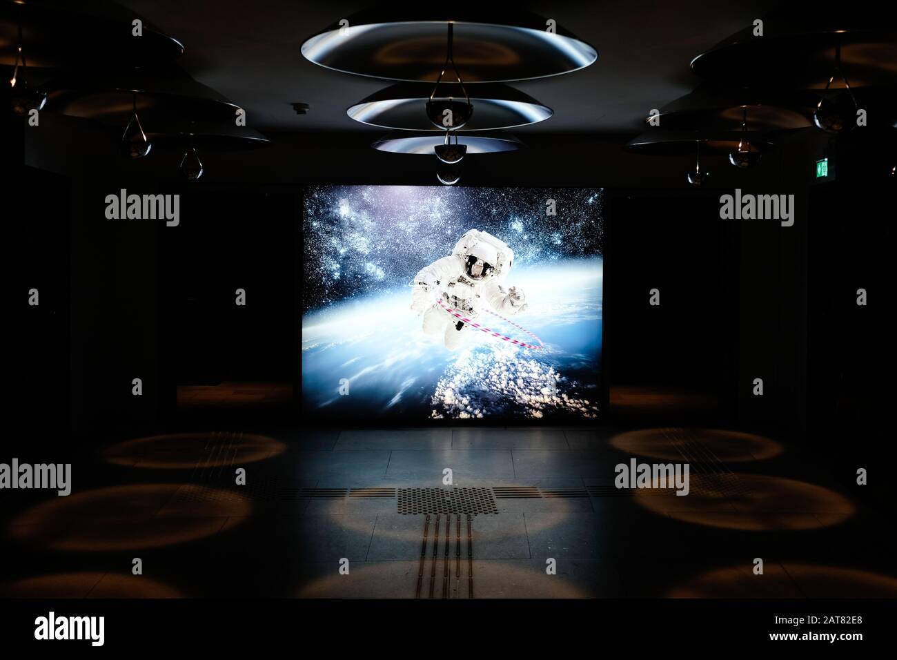 Huge image of spaceman in hotel lobby Stock Photo