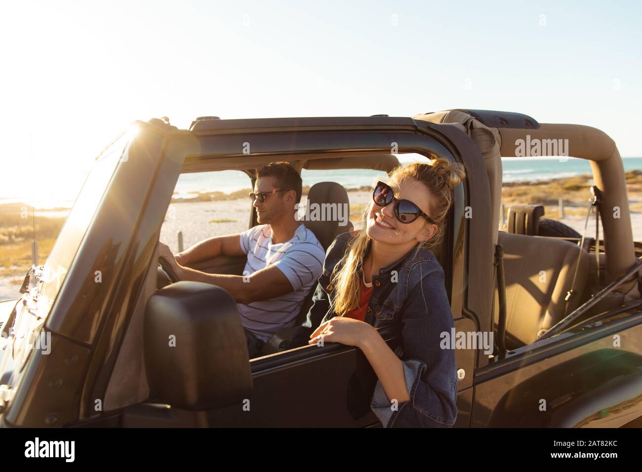 Couple in a car at the beach Stock Photo