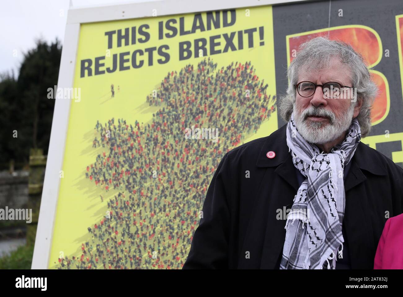 Former Sinn Fein leader Gerry Adams attends the unveiling of a Border Communities Against Brexit poster at a demonstration in Carrickcarnon on the Irish border, ahead of the UK leaving the European Union at 11pm on Friday. Stock Photo
