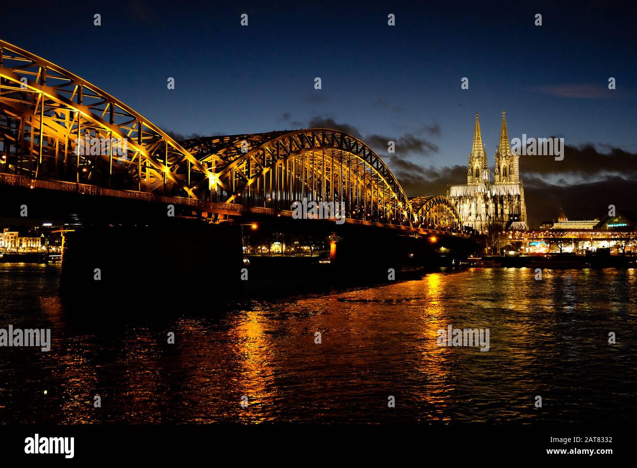 Beautiful bridge over the river Rhine in Cologne at night Stock Photo