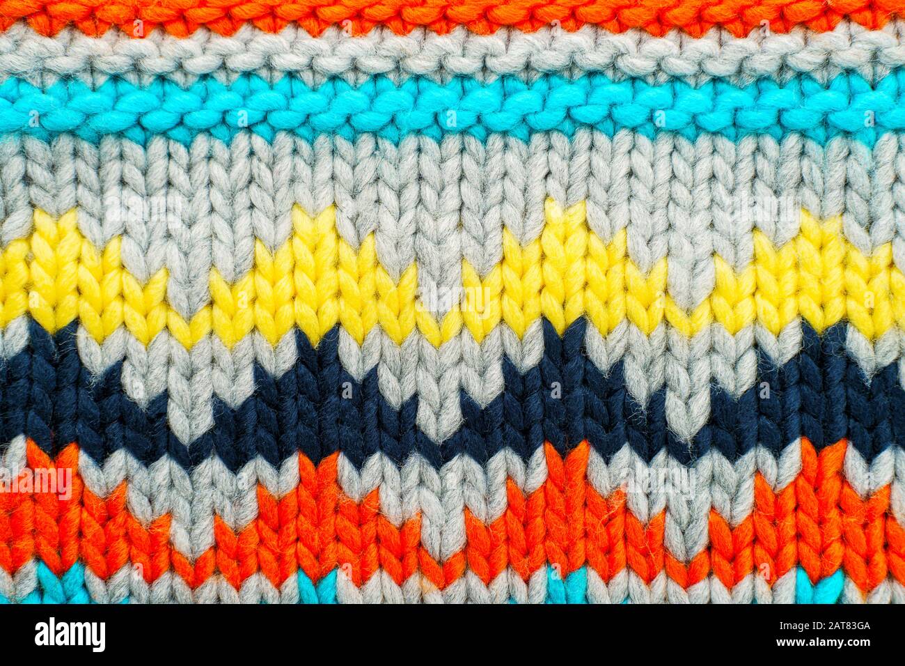 Handmade knitted multi-colored pattern. Hobby background Stock Photo