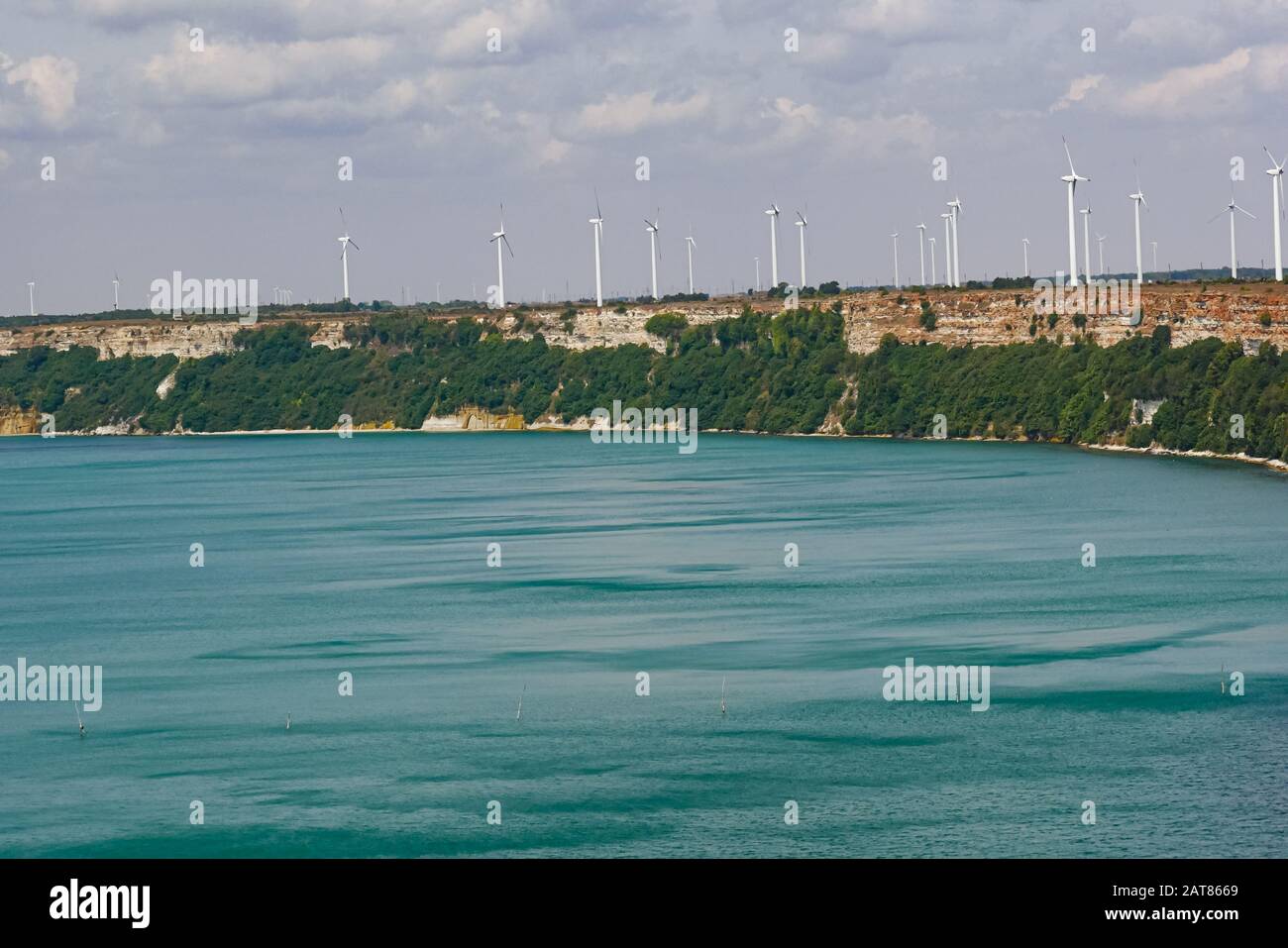 Rocky beach. Wind generators. Green electricity.  Black Sea. Cape Kaliakra, Bulgaria. Stock Photo