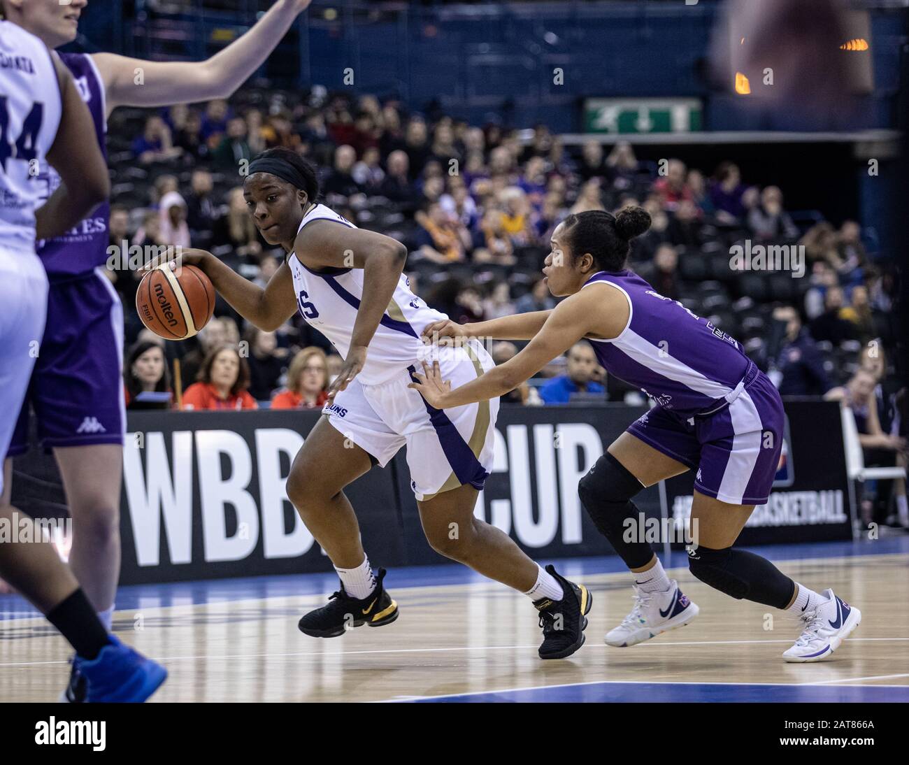 Birmingham, UK, 26 January, 2020.  Sevenoaks Suns defeat Durham Palatinates, 74-64 to win the WBBL cup at Arena Birmingham, Birmingham UK. Suns' Janice Monakana with the ball, Durham's Nicolette Fyong Lyew Quee in pursuit. copyright Carol Moir. Stock Photo