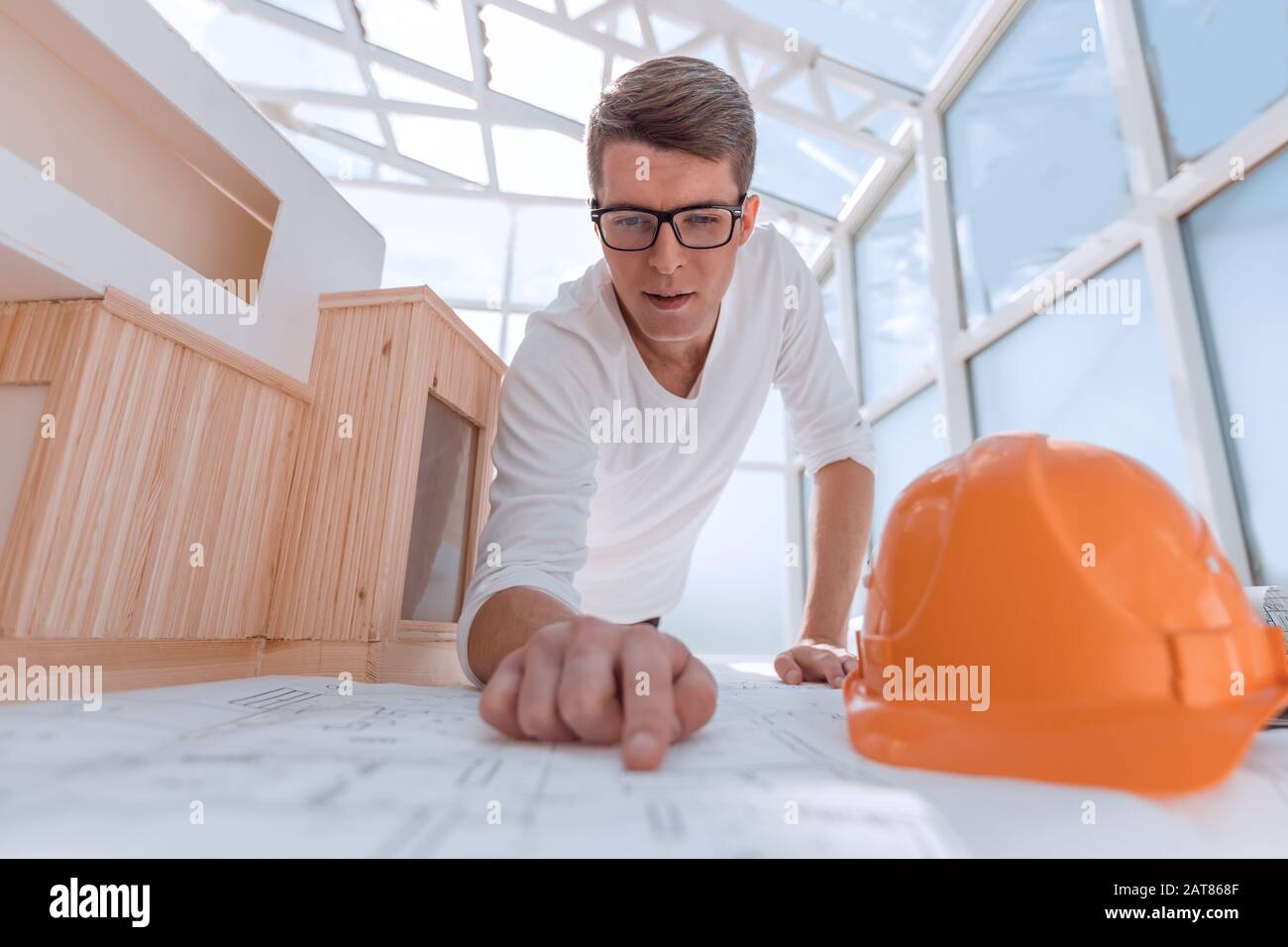 experienced architect doing calculations for new project Stock Photo