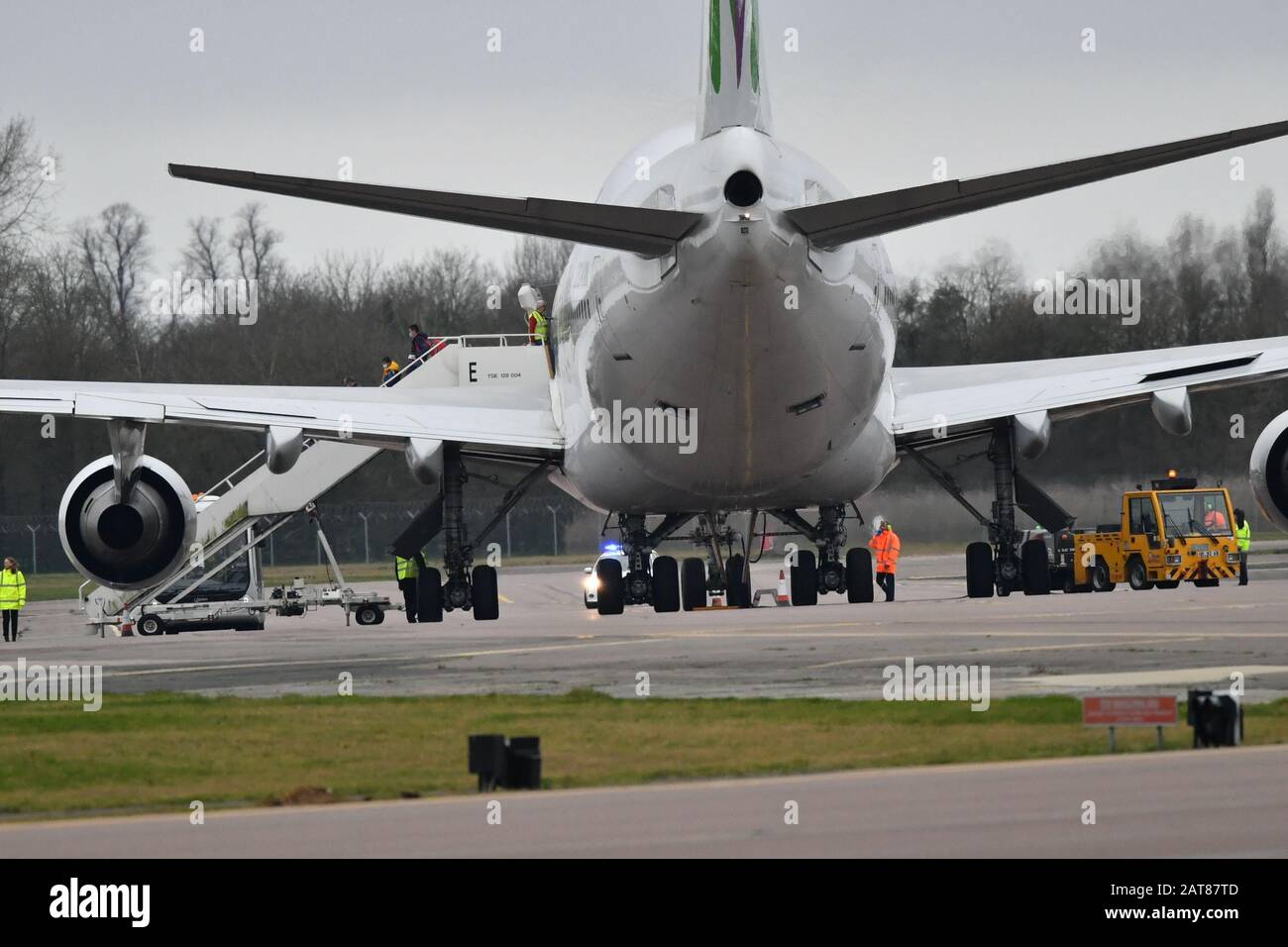Passengers disembark from the plane carrying British nationals from the coronavirus-hit city of Wuhan in China, arrives at RAF Brize Norton in Oxfordshire. PA Photo. Picture date: Friday January 31, 2020. See PA story HEALTH Coronavirus. Photo credit should read: Ben Birchall/PA Wire Stock Photo