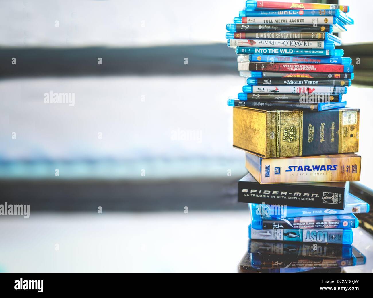 Passion for cinema, a stack of movie collection in blue ray disc format in Hollywood Stock Photo