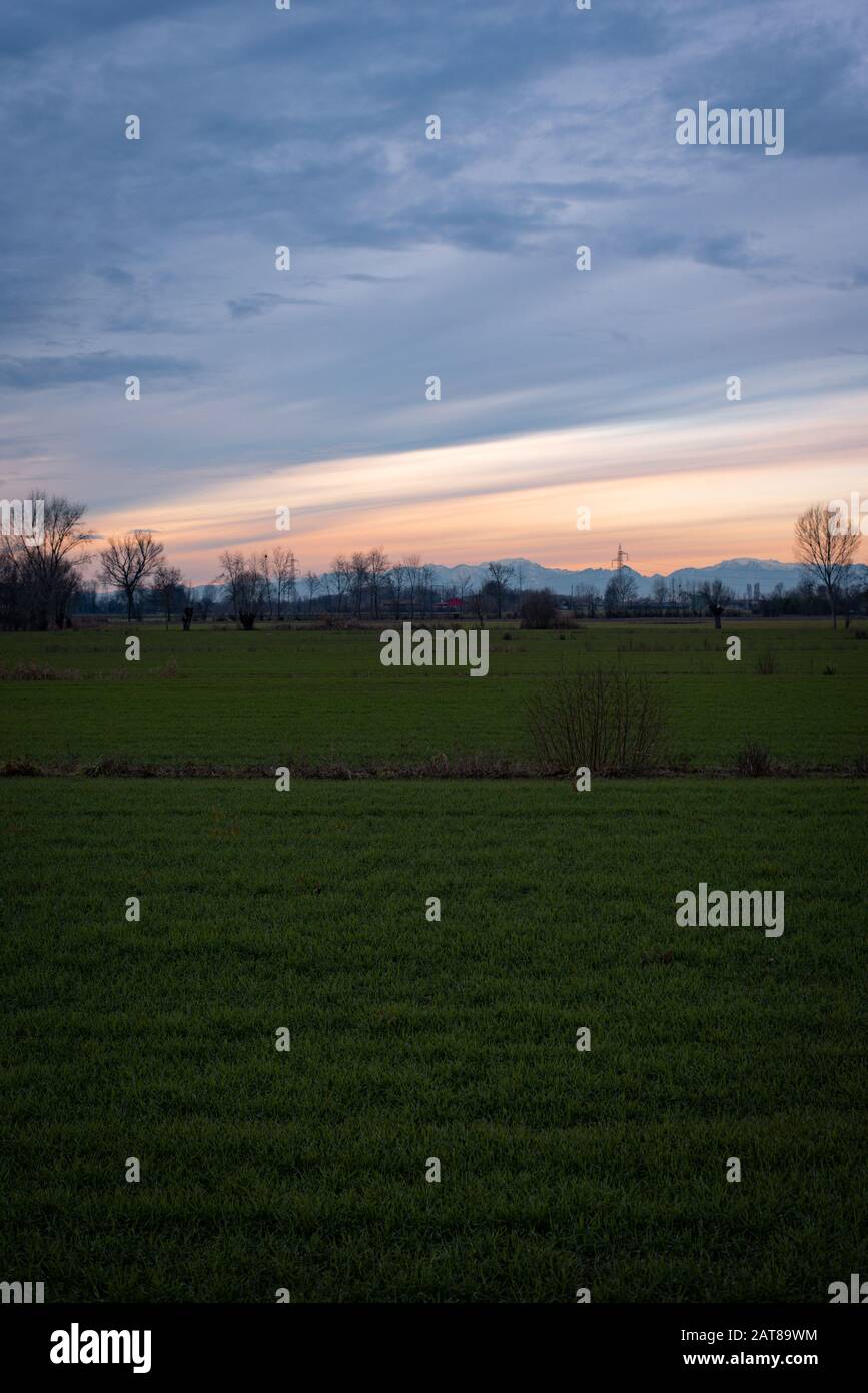 Rural landscape with view of the alps in northern Italy Stock Photo - Alamy