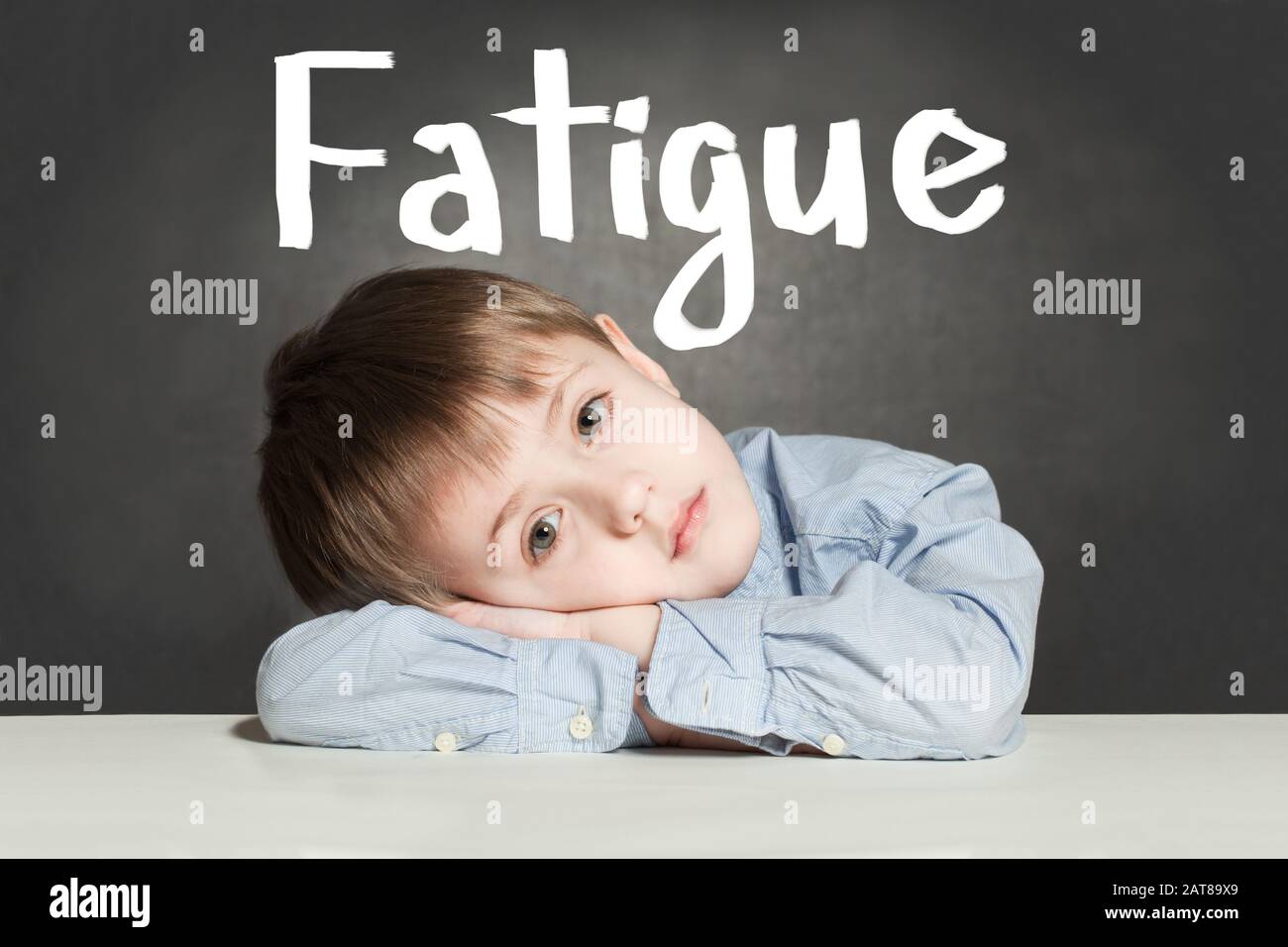 Tired sad child boy with fatigue Stock Photo