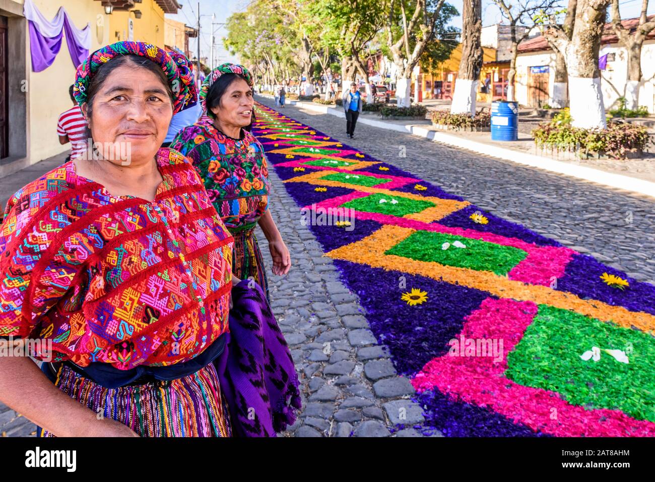 Antigua, Guatemala - April 14, 2019: Maya ladies & Palm Sunday procession carpet in UNESCO World Heritage Site with famed Holy Week celebrations. Stock Photo
