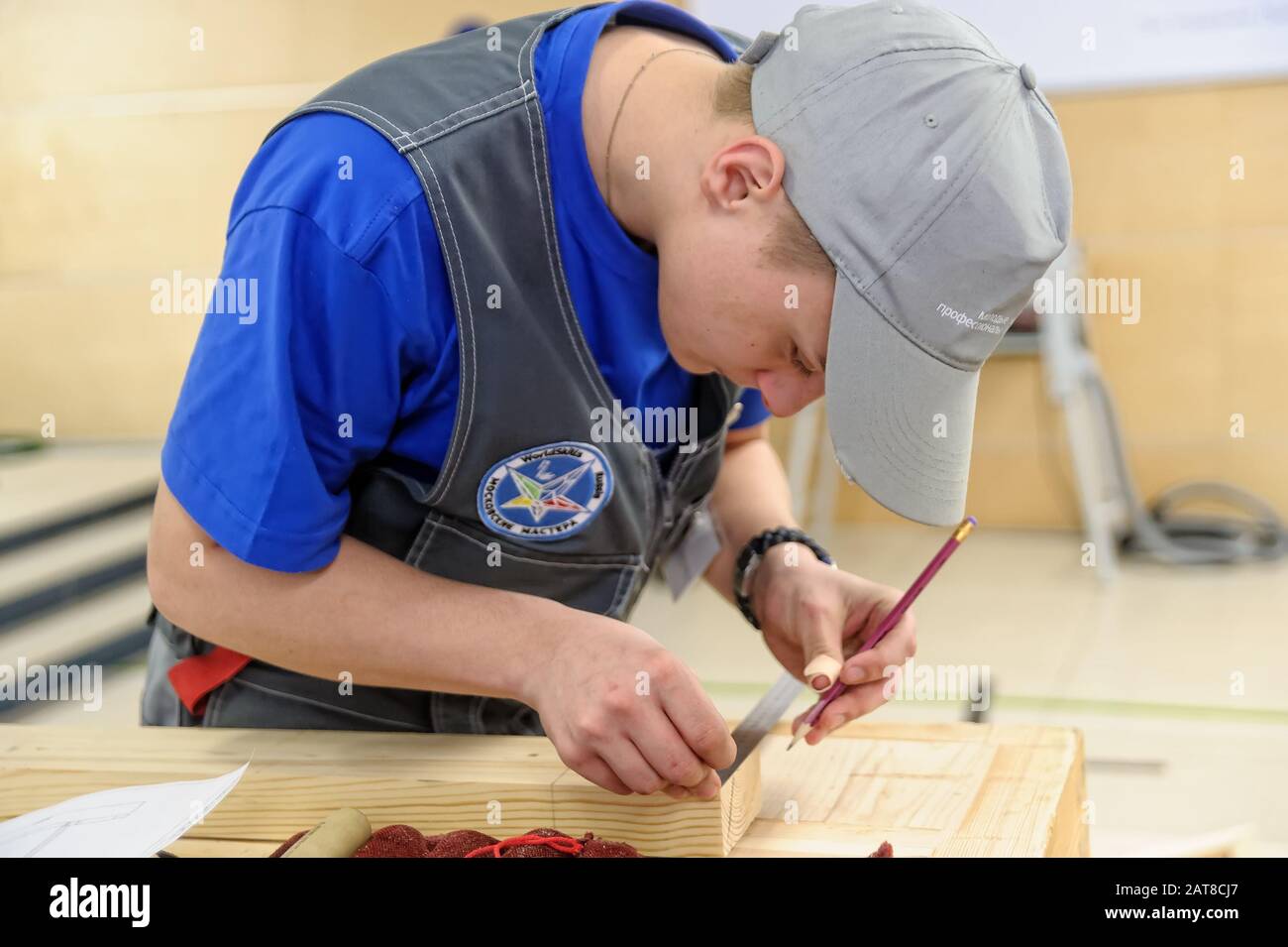 Young carpenter performs task of competition Stock Photo - Alamy