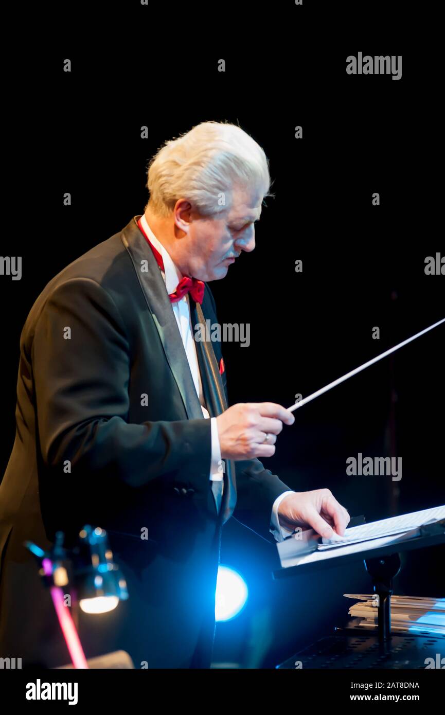 Conductor directing orchestra Stock Photo - Alamy