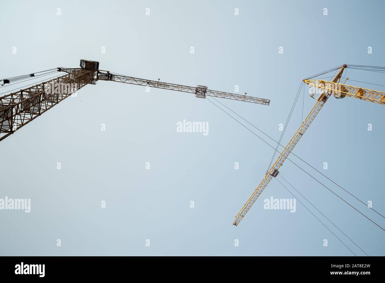 Cranes on house construction Stock Photo Alamy