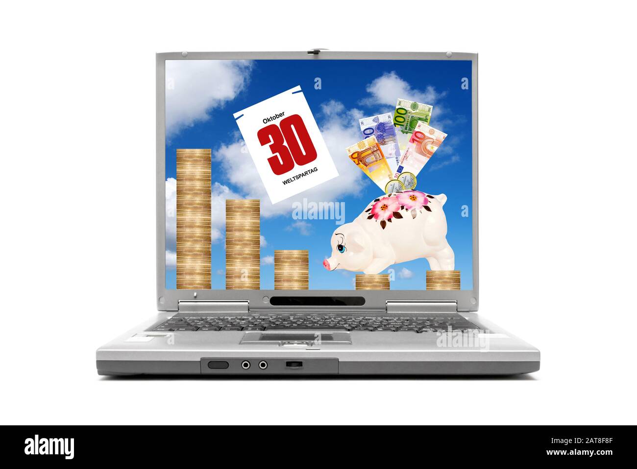 laptop displaying piggybank with banknotes standing on Euro coins, composing with calendar sheet dated 30.10., World Savings Day Stock Photo
