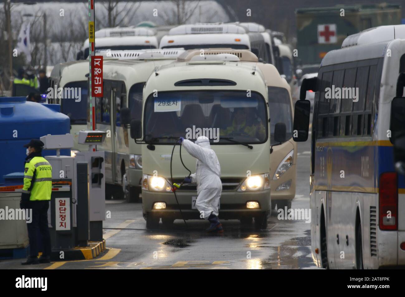 Seoul, South Korea. 31st Jan, 2020. The arrival of about 370 South Korean evacuees from the coronavirus-hit Chinese city of Wuhan headed in 36 police buses for two government-designated accommodations in central parts of the nation Friday after arriving at Gimpo International Airport in western Seoul in the morning. The first batch of 368 South Korean residents of Wuhan, who landed in Gimpo aboard a chartered Korean plane, will be asked to stay at two government-run facilities for the next 14 days. Credit: Ryu Seung-Il/ZUMA Wire/Alamy Live News Stock Photo