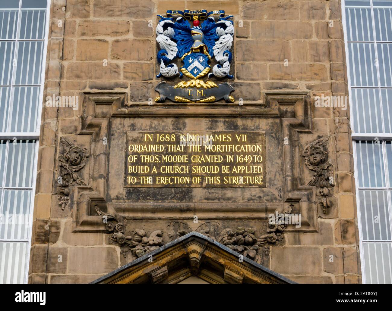 Close up of front of repainted Canongate Kirk or Church with gold James VII inscription, Royal Mile, Edinburgh, Scotland, UK Stock Photo