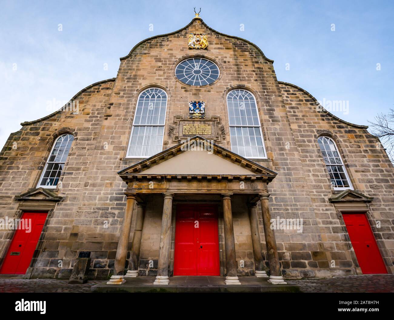 Newly restored Dutch style 17th century Canongate Kirk or Church with portico and red doors, Royal Mile, Edinburgh, Scotland, UK Stock Photo