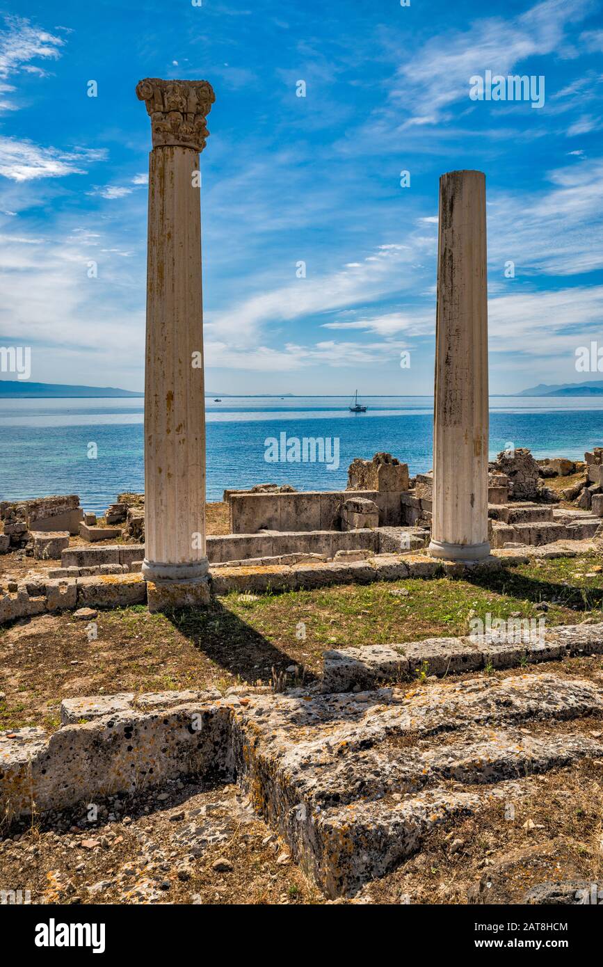 Tempio Tetrastilo, Two Columns area, Golfo di Oristano in distance, Archaeological Site of Tharros, municipality of Cabras, Sardinia, Italy Stock Photo