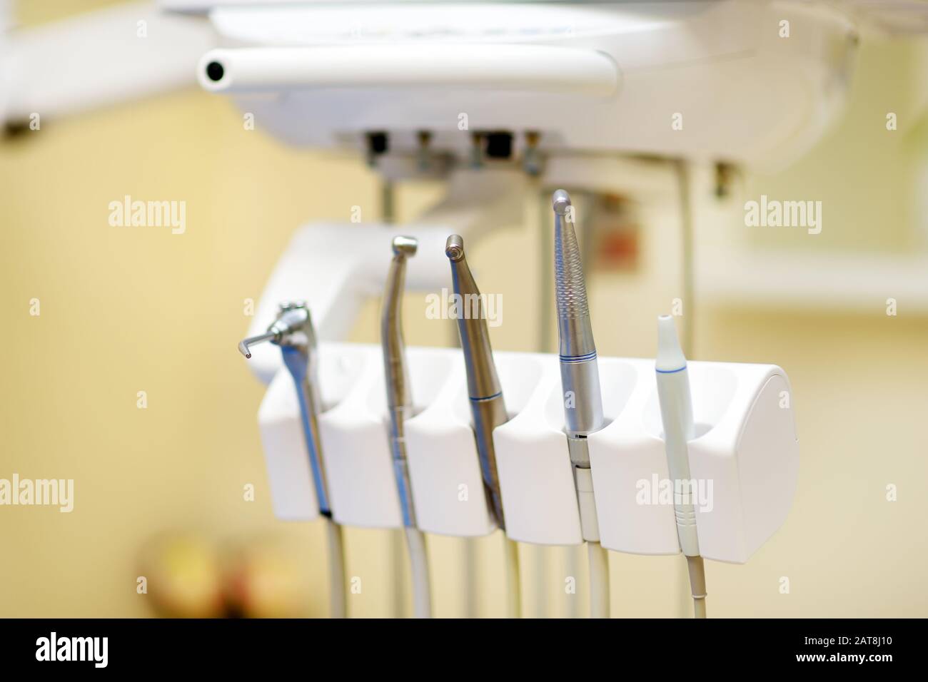 Different dental instruments and tools in a dentists office. Closeup of a modern dentist tools and burnishers. Stock Photo