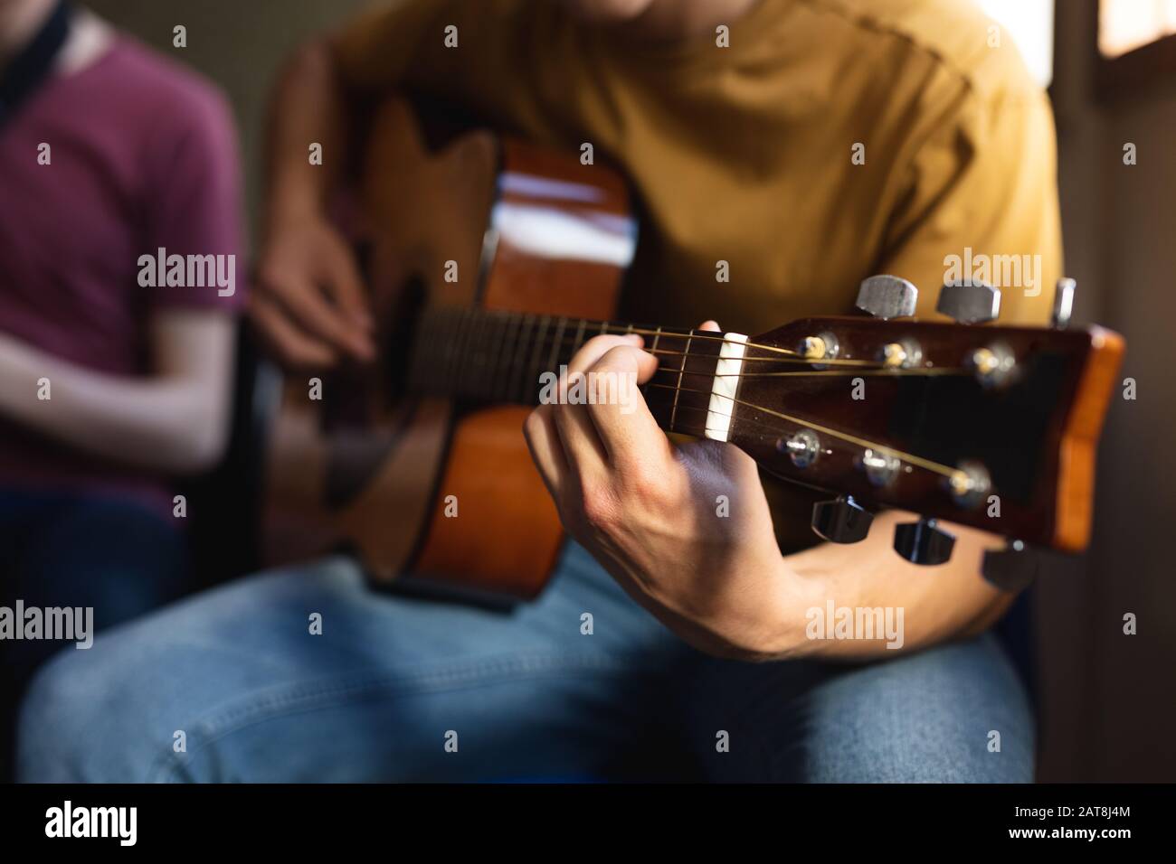 Teenage musician rehearsing Stock Photo - Alamy