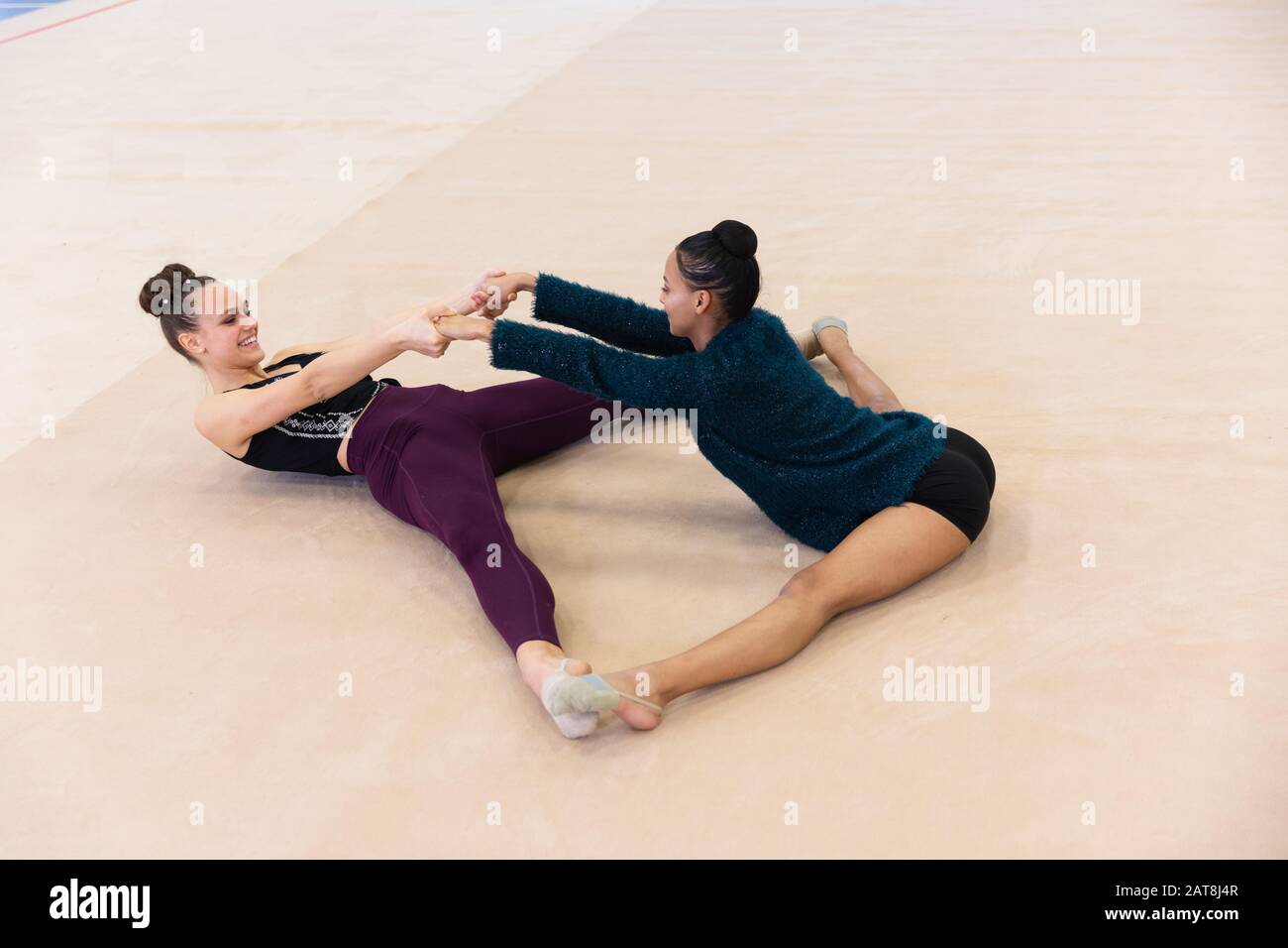 Gymnasts stretching at the gym Stock Photo