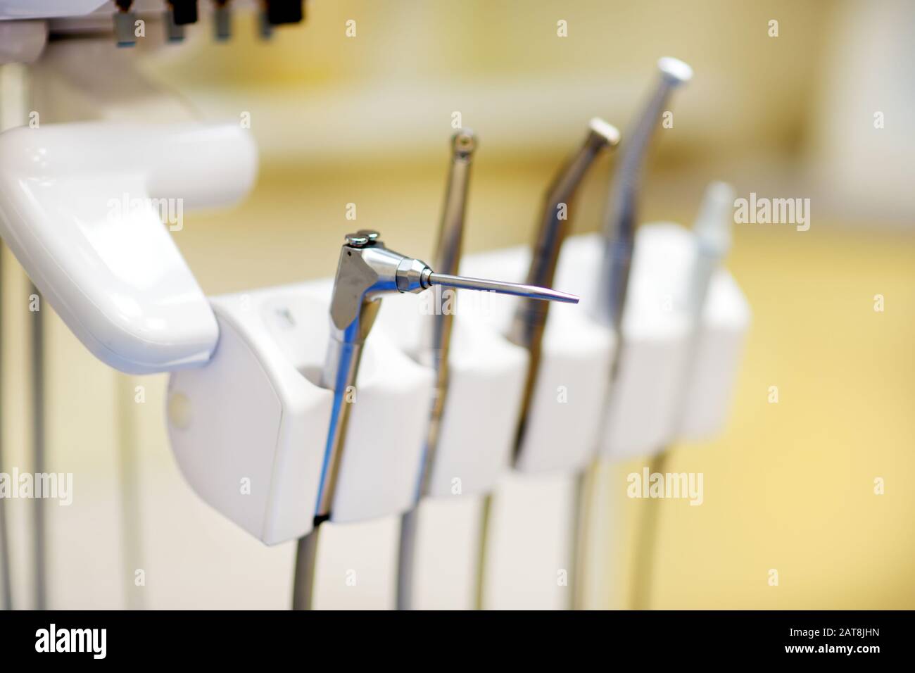 Different dental instruments and tools in a dentists office. Closeup of a modern dentist tools and burnishers. Stock Photo