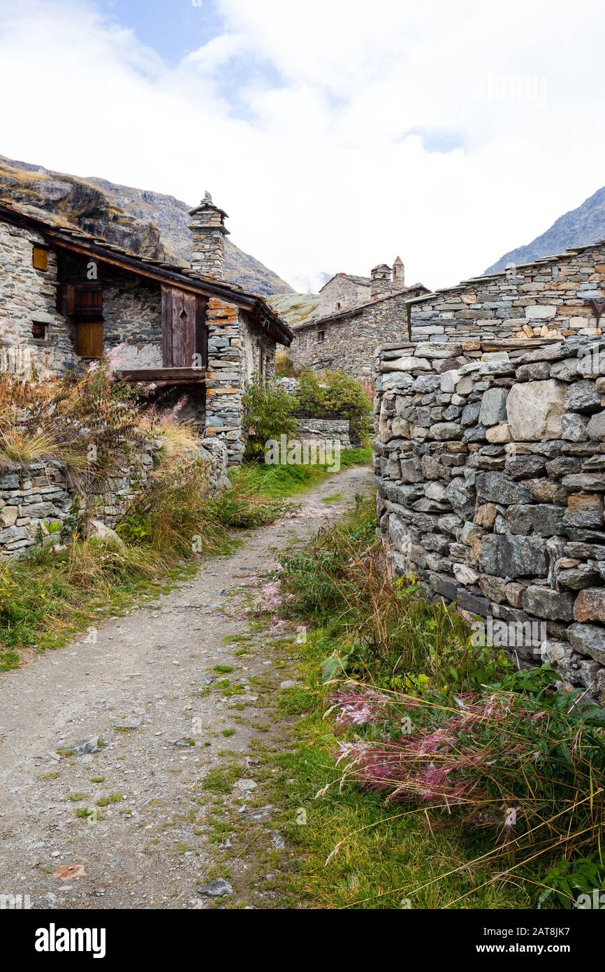 Old houses in the Alps mountains. Stone walls, nobody Stock Photo Alamy