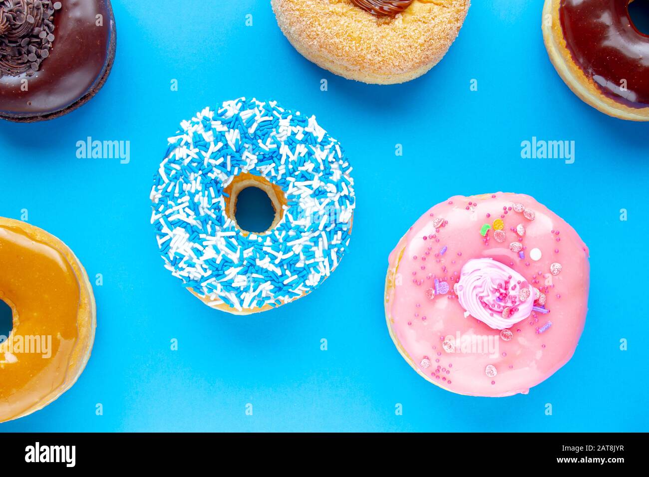 Colorful Donuts on a blue background Stock Photo