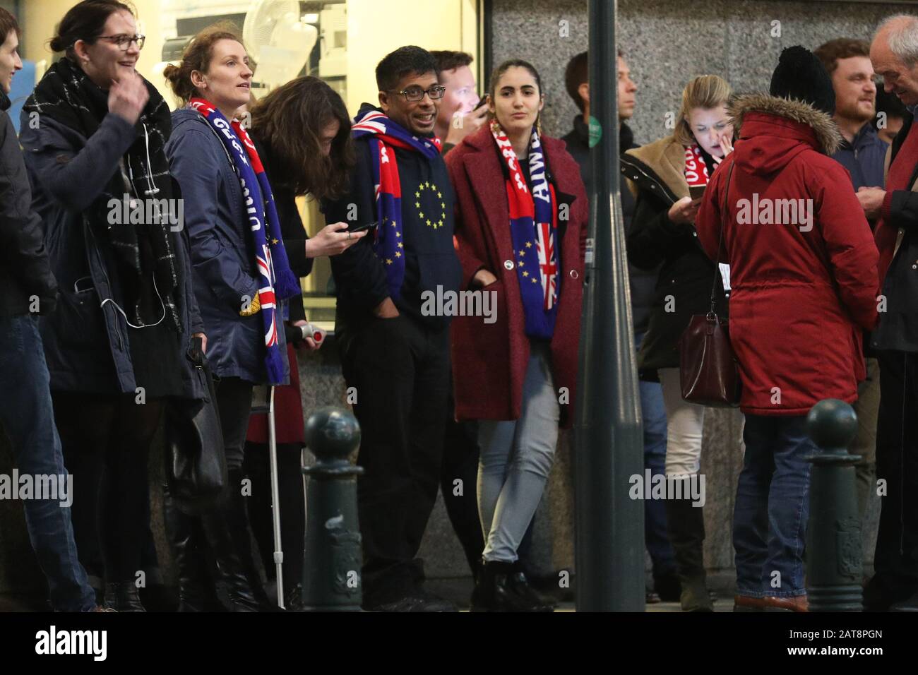 Pro-EU supporters wait outside the European Parliament in Brussels, Belgium, as they prepare to take down the Union flag ahead of the UK leaving the European Union at 11pm on Friday. Stock Photo