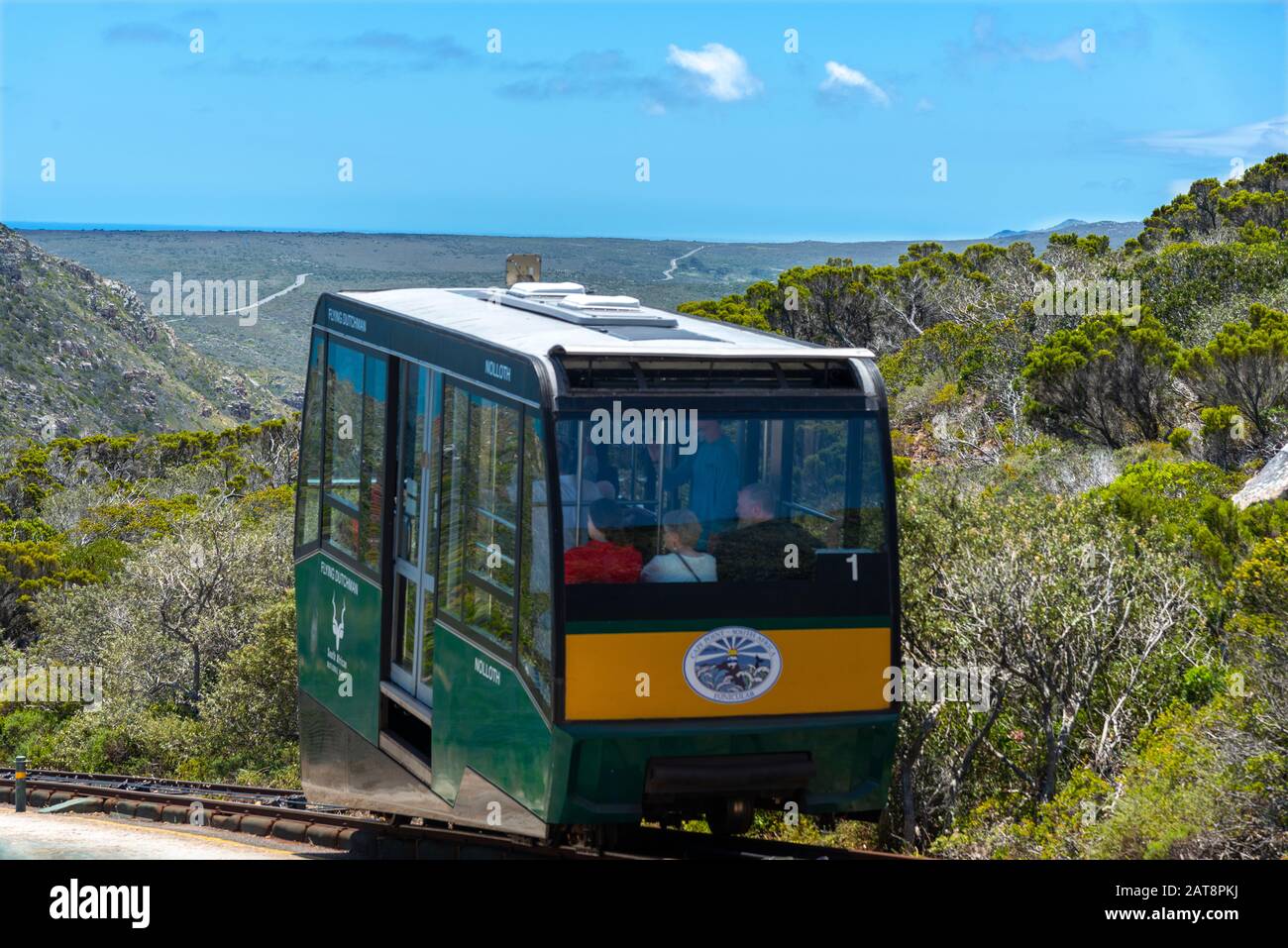 Tourists travel on the Flying Dutchman funicular from the viewing platform below the old Cape Point lighthouse, Cape Point National Park, South Africa Stock Photo