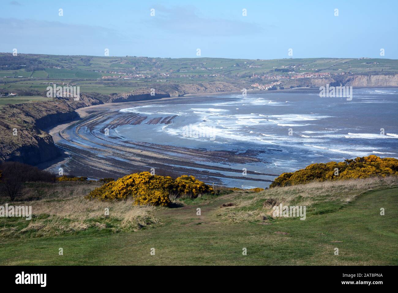 A view of Robin Hood's Bay and the North Sea at low tide, North York Moors National Park, Yorkshire, England, United Kingdom. Stock Photo