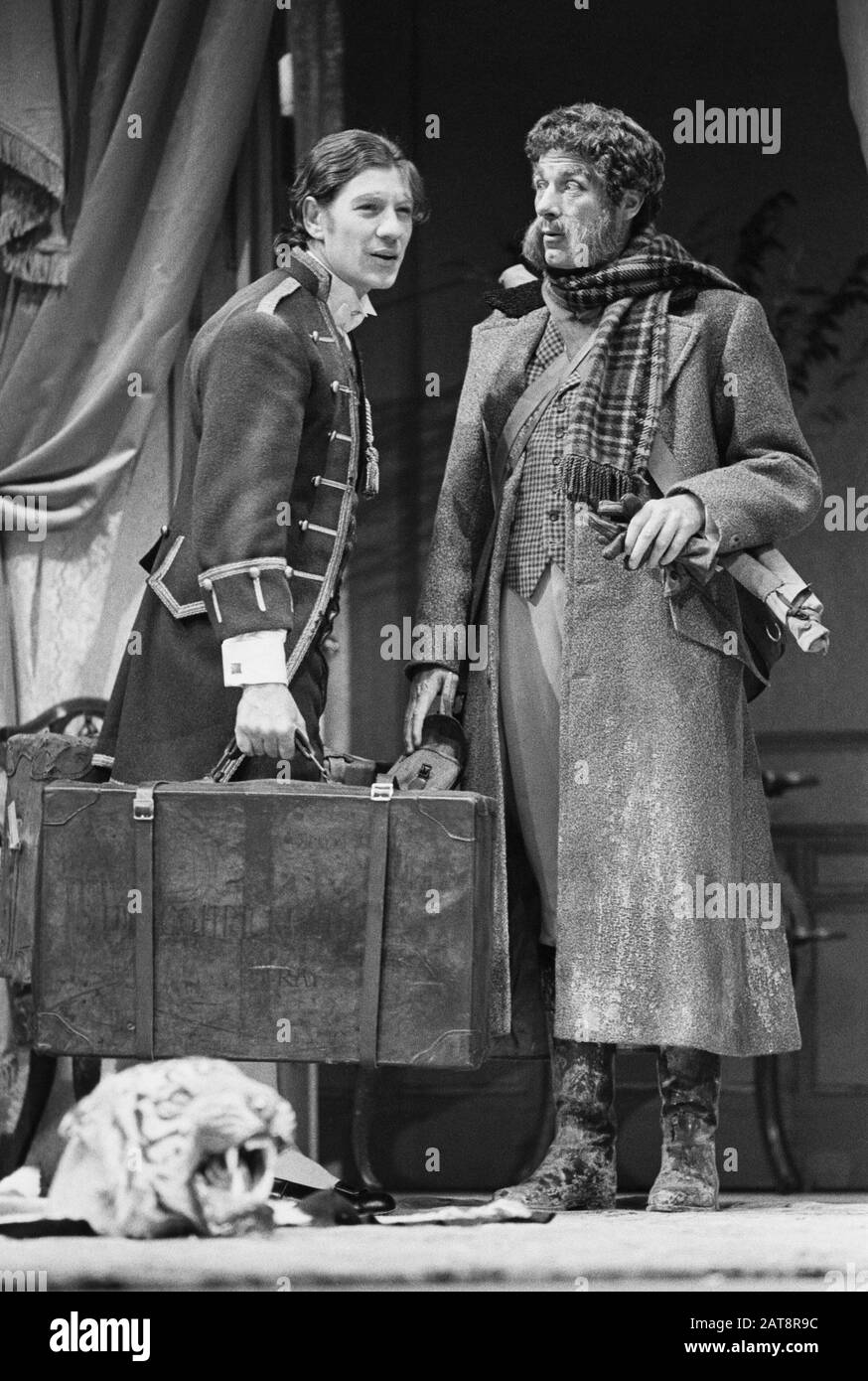 Ian McKellen (Lady Wishfort's Footman) and John Woodvine (Sir Wilful Witwoud) in THE WAY OF THE WORLD by William Congreve directed by David William for the Actors Company UK Tour in 1973. Sir Ian Murray McKellen, born 1939, Burnley, England. English stage and film actor. Co-founder of Stonewall, gay rights activist, knighted in 1990, made a Companion of Honour 2007. Stock Photo