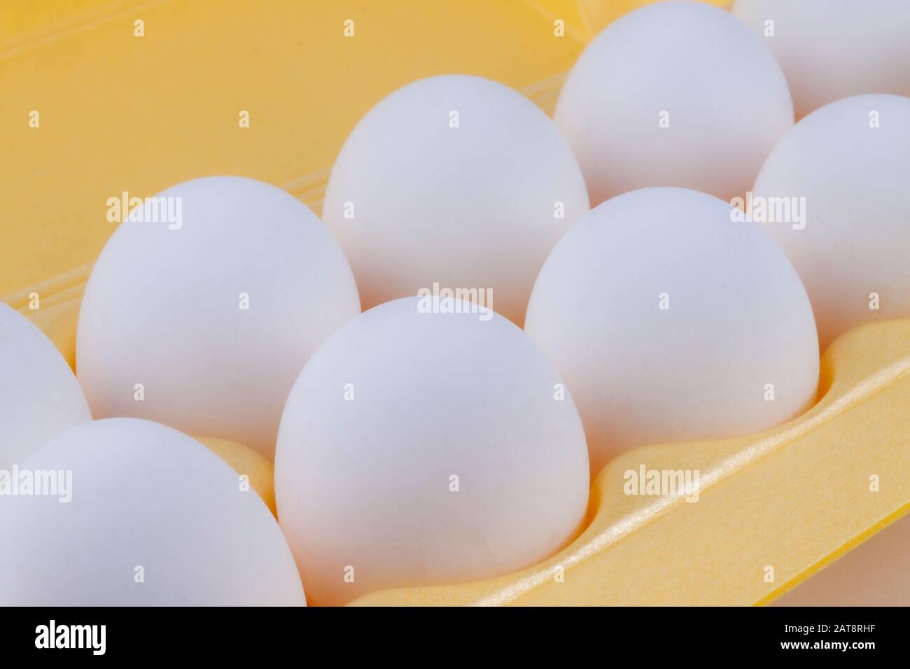 White chicken eggs lie in the package. Stock Photo
