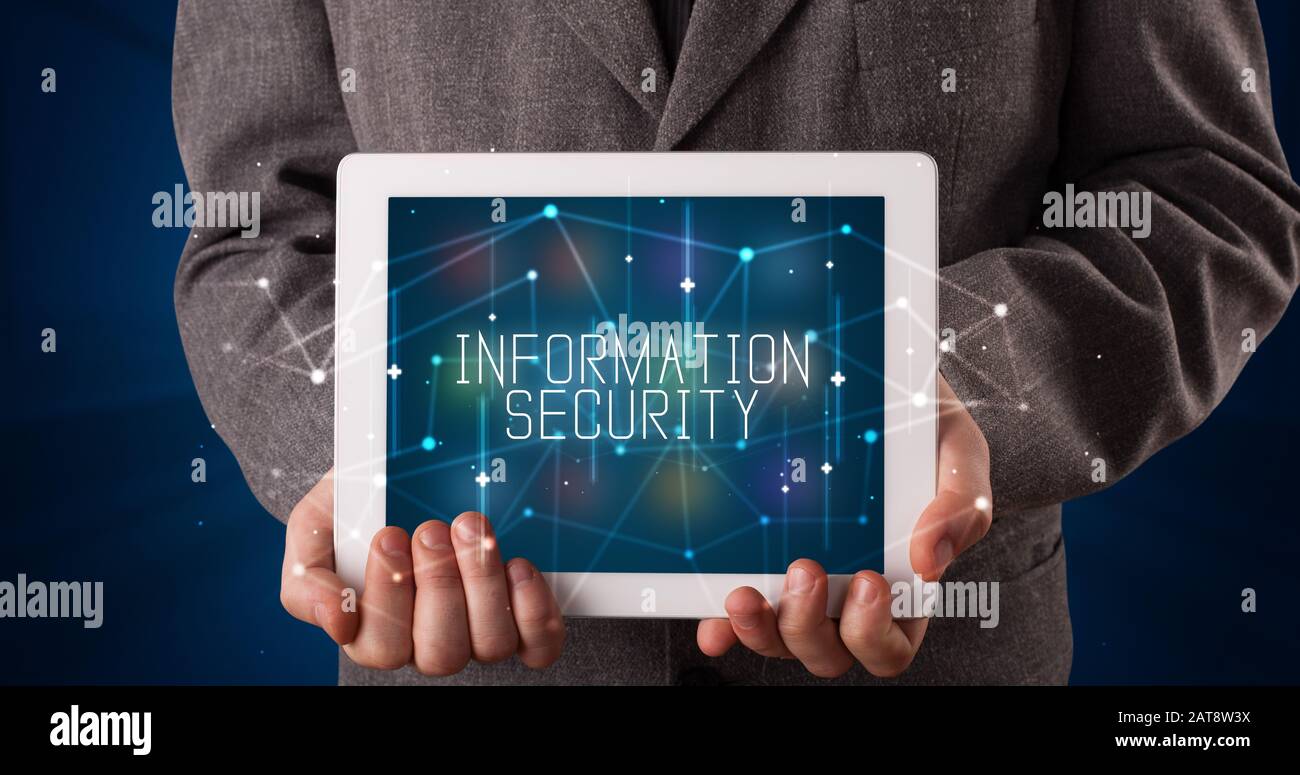Young business person working on tablet and shows the digital sign ...
