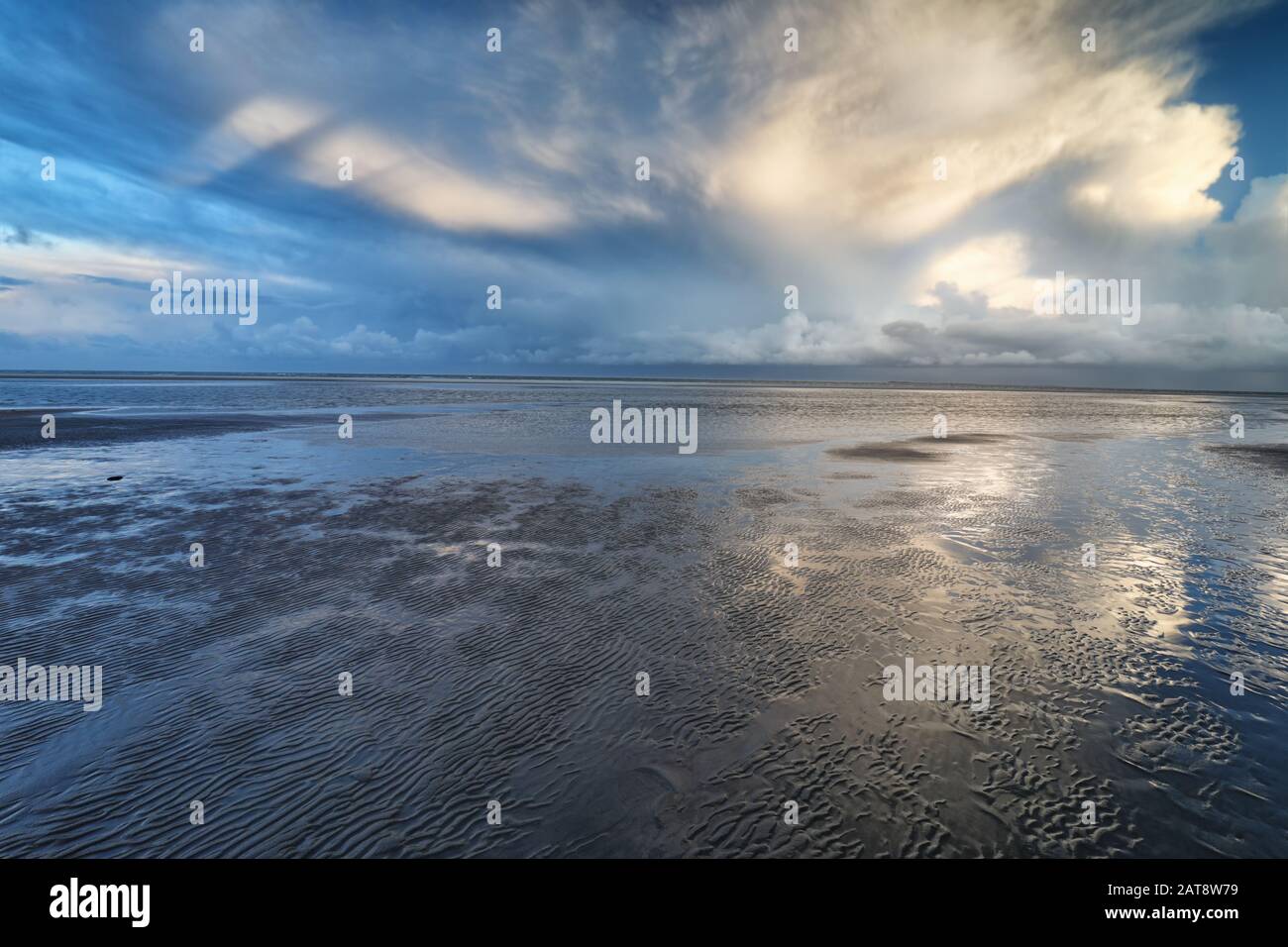 dramatic clouds over sea coast at low tide Stock Photo - Alamy