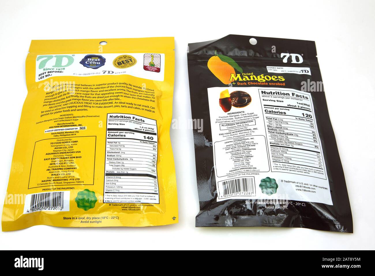 Packaged Dried Mangoes from Philippines and Chocolate Covered Dried Mangoes showing Nutrition Information Stock Photo